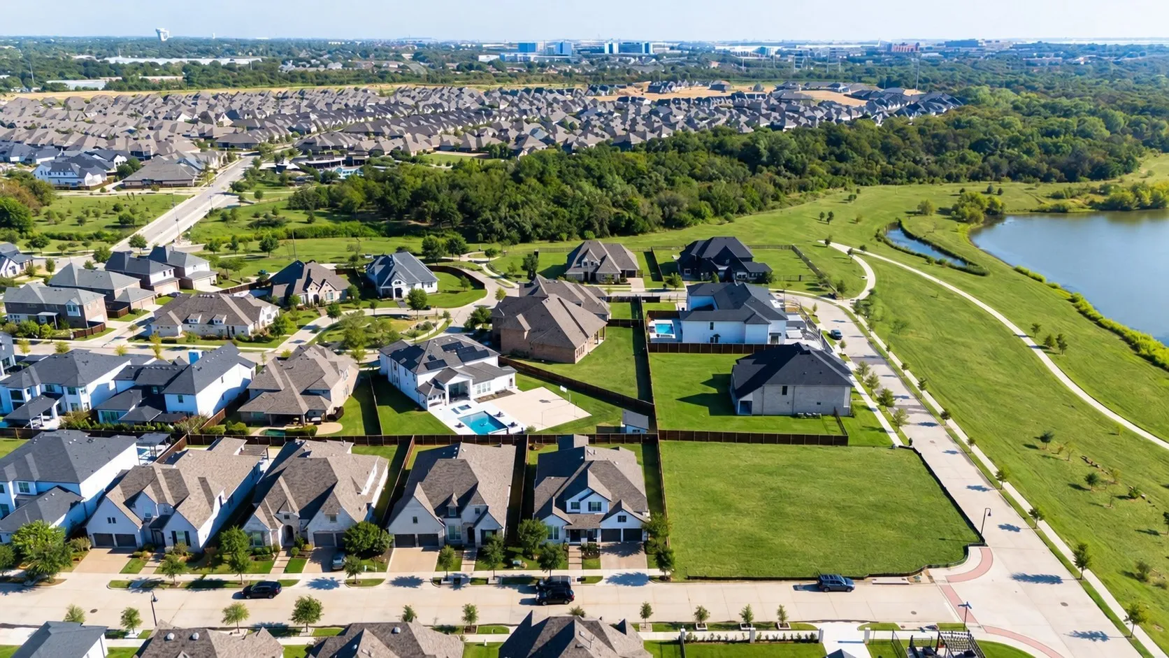 Established residential neighborhood featuring a variety of architectural styles, expansive green spaces, and a prominent water feature