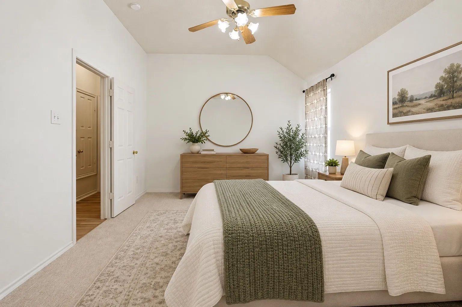 Vaulted ceiling with an attached ceiling fan, carpet flooring, window with curtain rods, and a white six-panel door