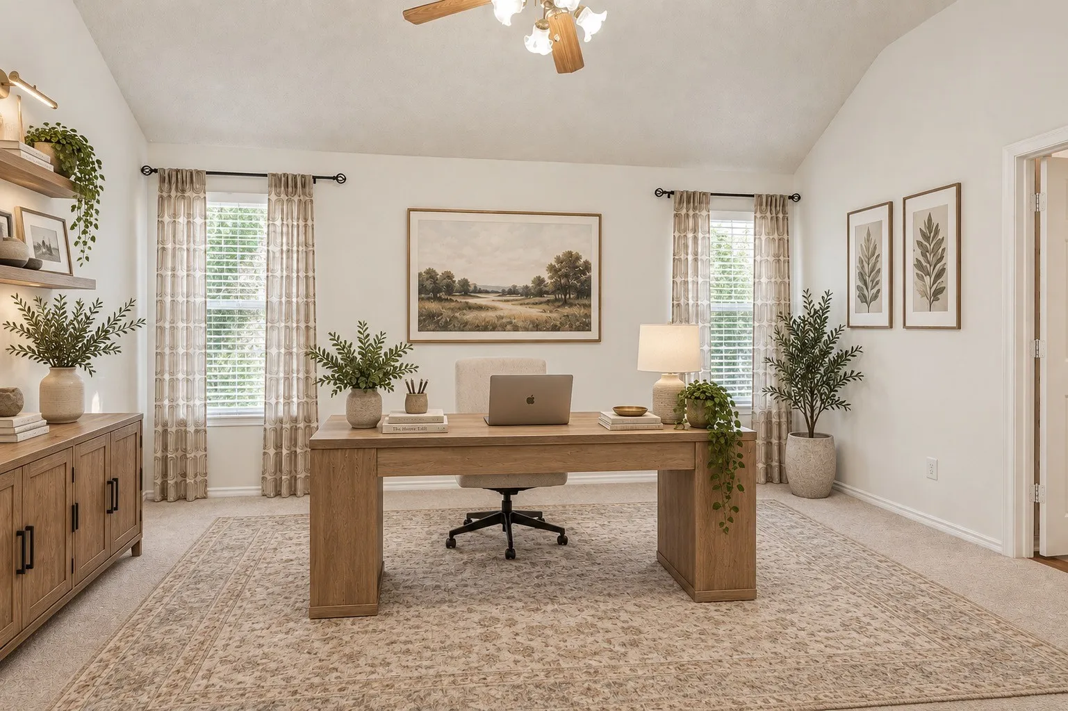 Vaulted ceiling with a ceiling fan, dual windows with blinds, recessed shelving with integrated lighting, wood-finish desk, and carpeting