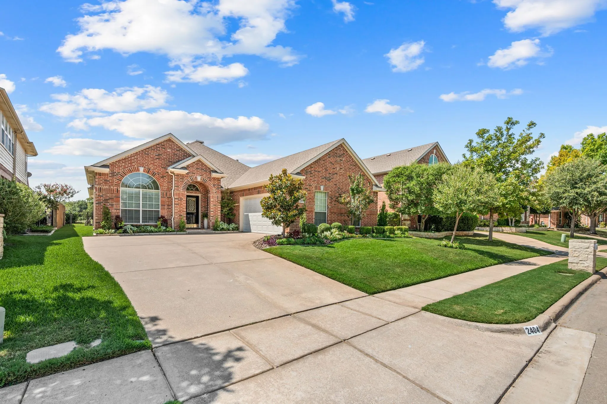 Beautiful curb appeal and lush landscaping.