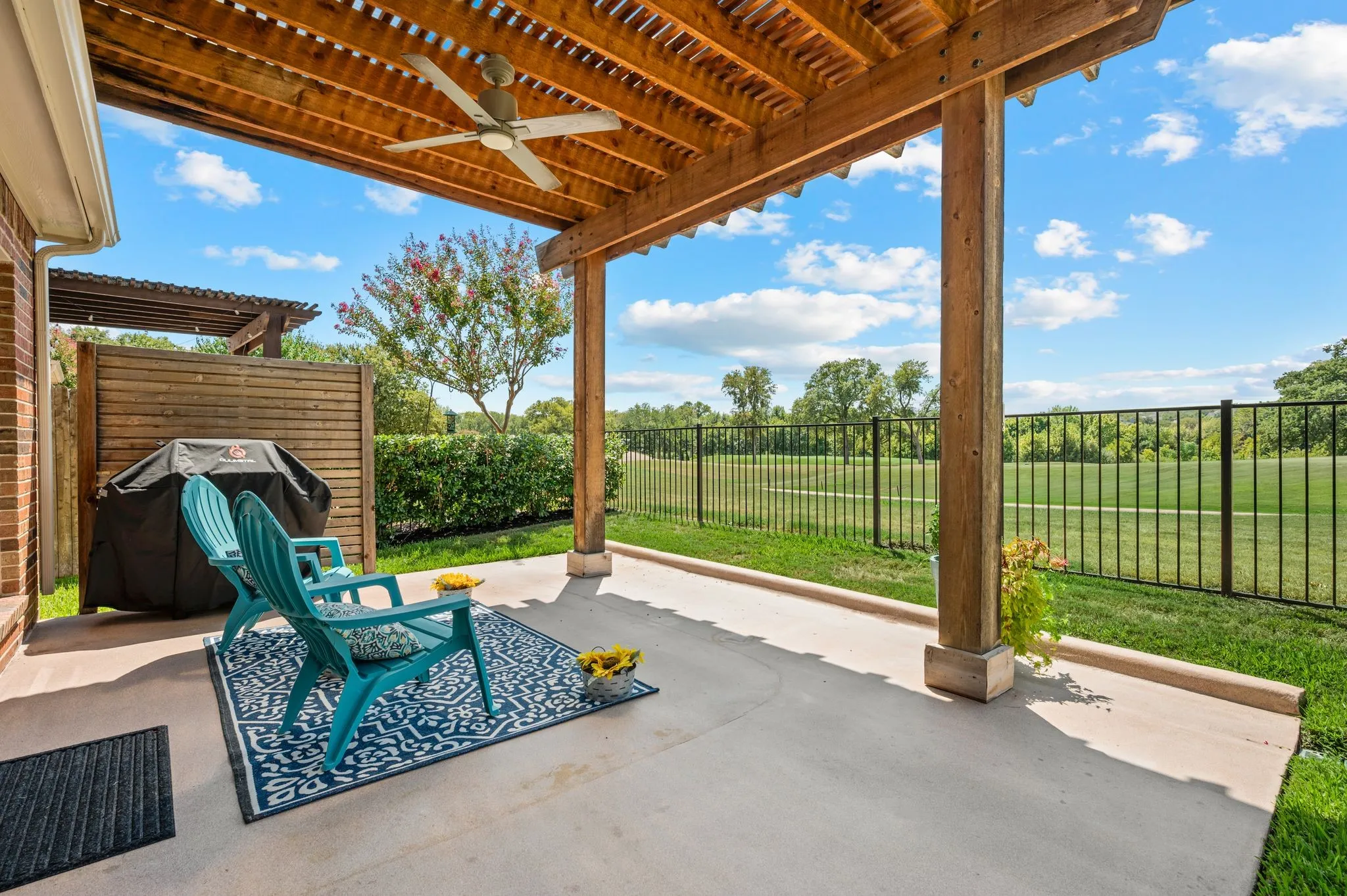 Beautiful extended patio and pergola overlooking the incredible view of the golf course.