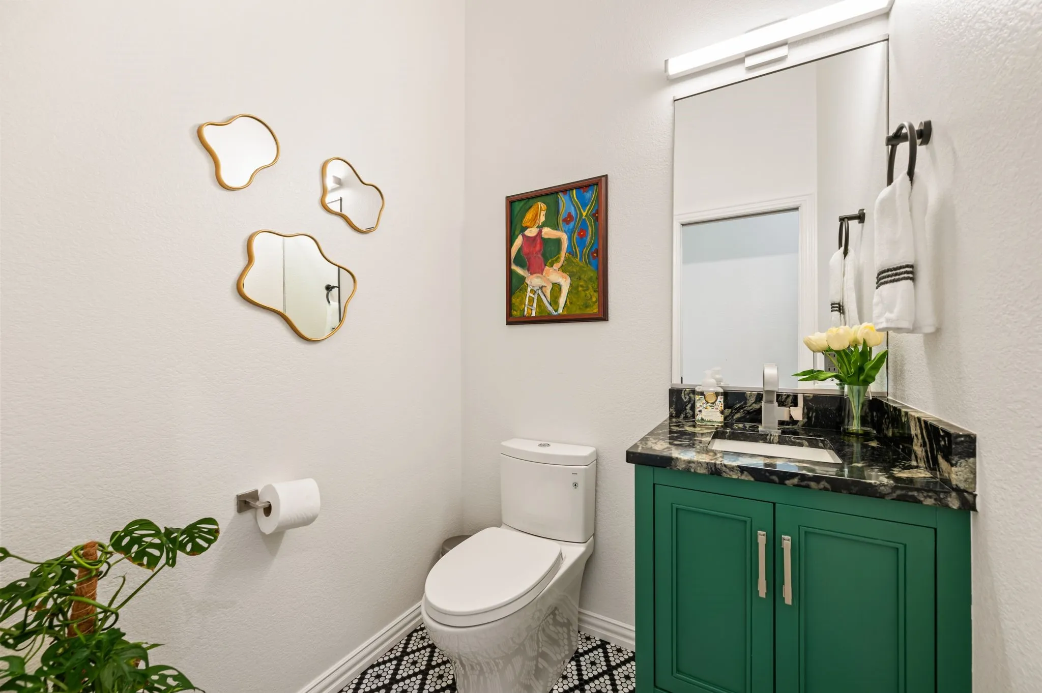 Custom stylish half bath was added to the home. Located to the right of dining room. So beautiful and charming!