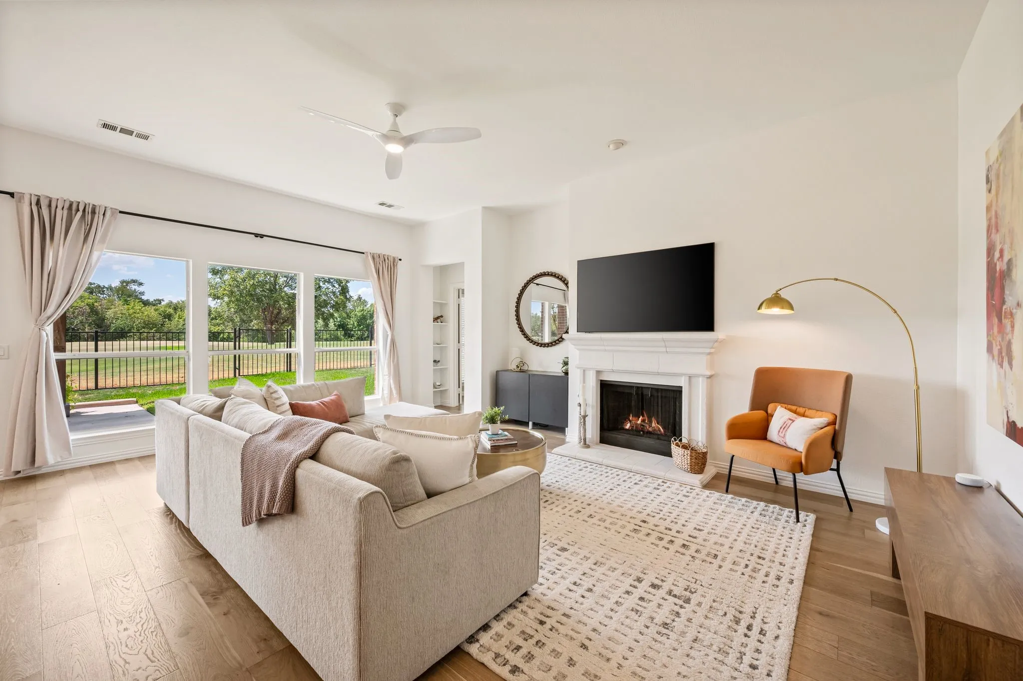 Gas fireplace that enhances the beauty of this spacious living room.