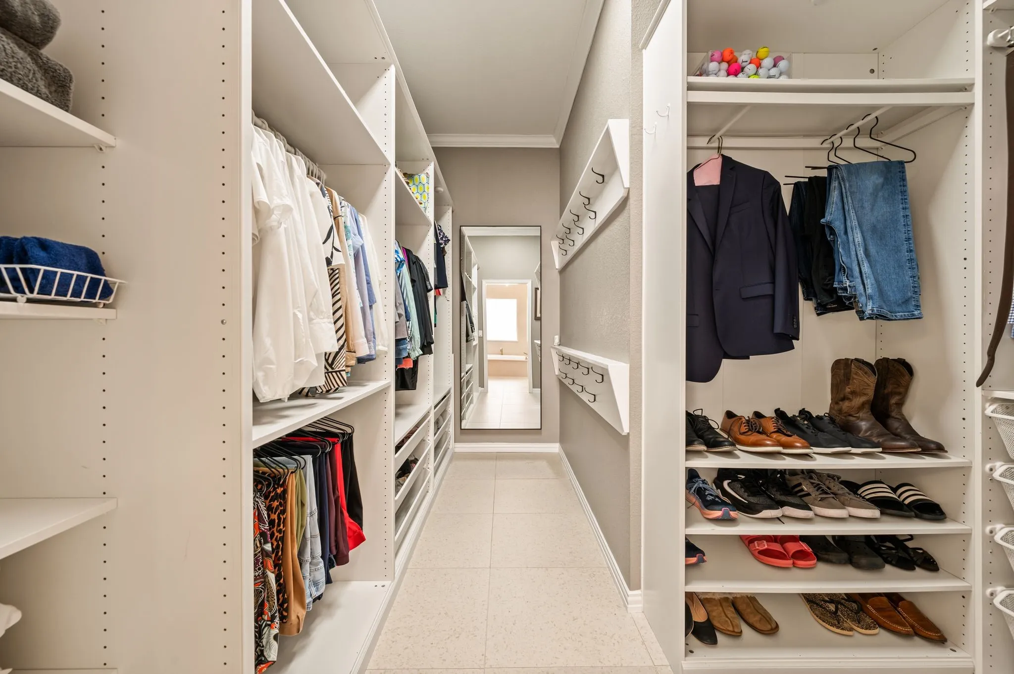 Custom closet system in Primary.