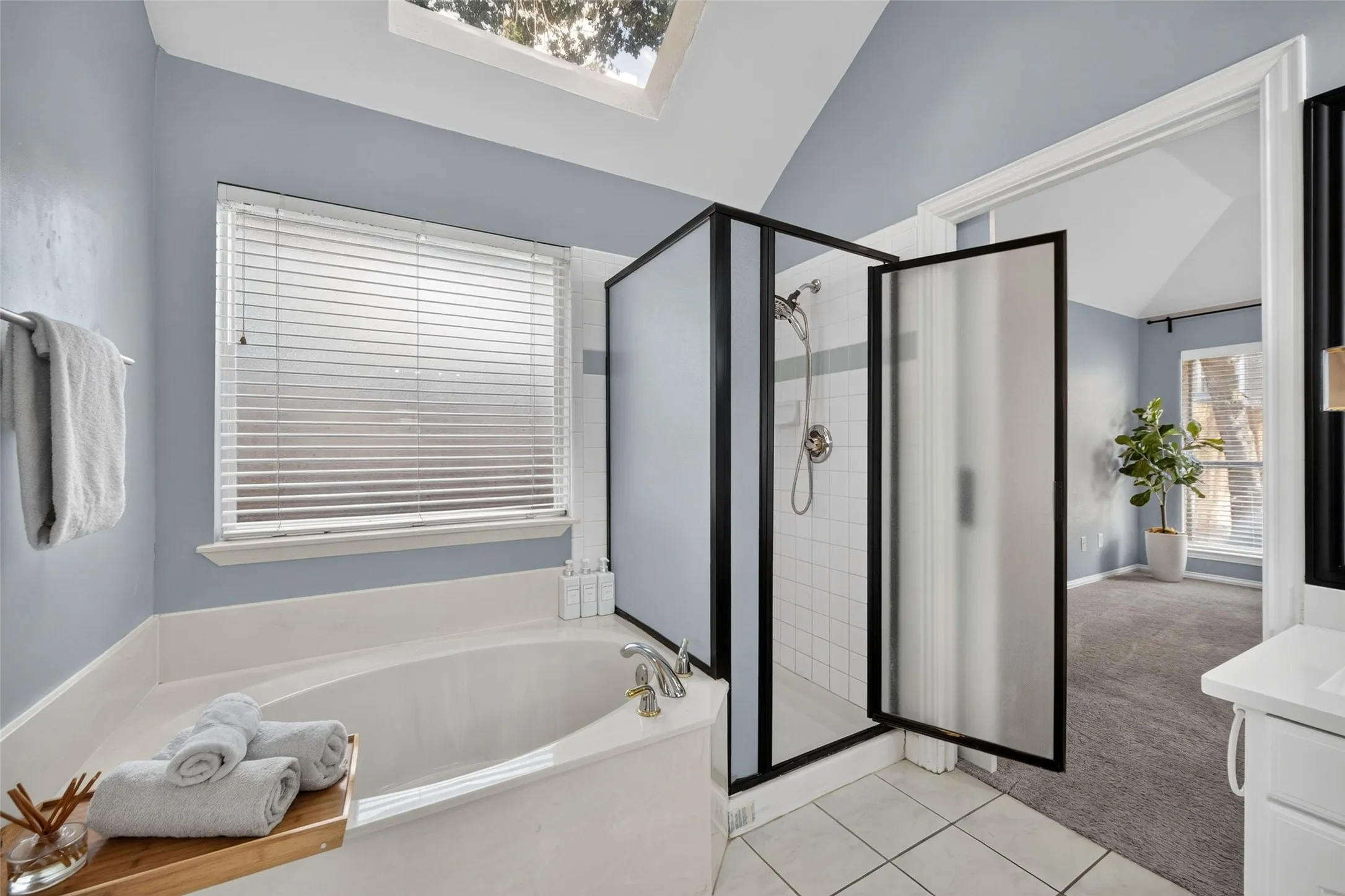 Soaking tub with deck-mounted faucet