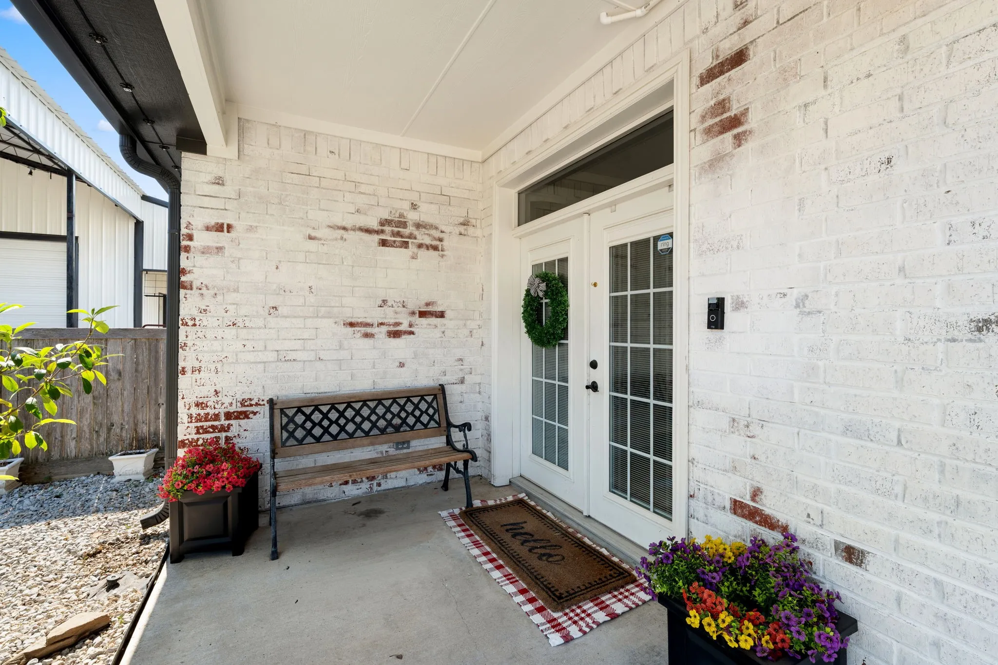 Painted brick exterior with a covered concrete porch