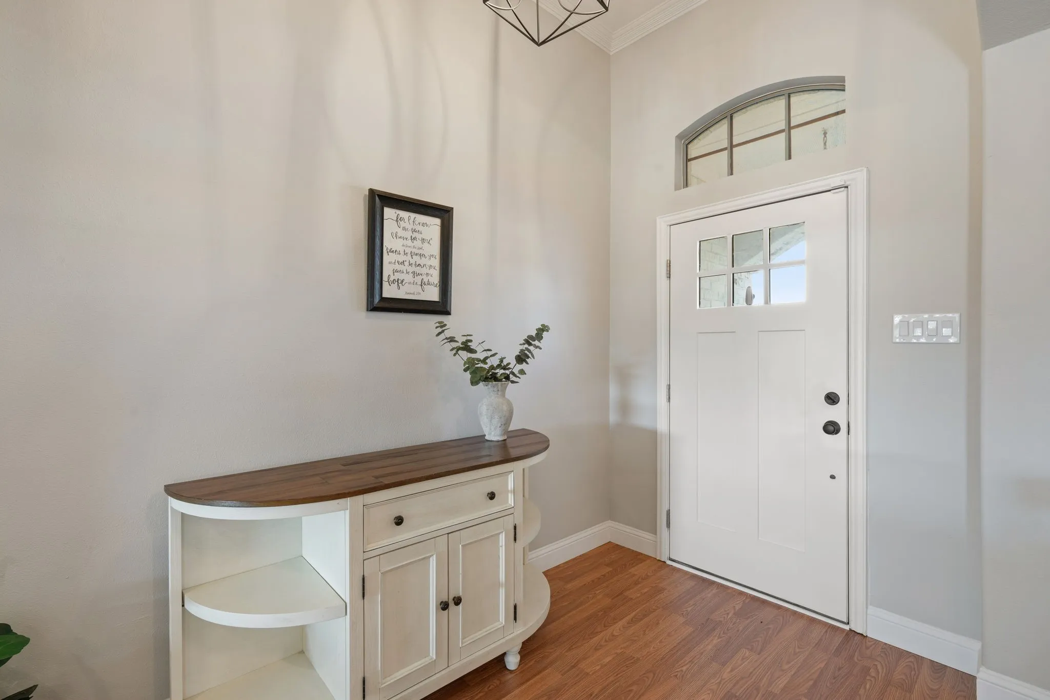 Hardwood-finish flooring complementing light wall tones