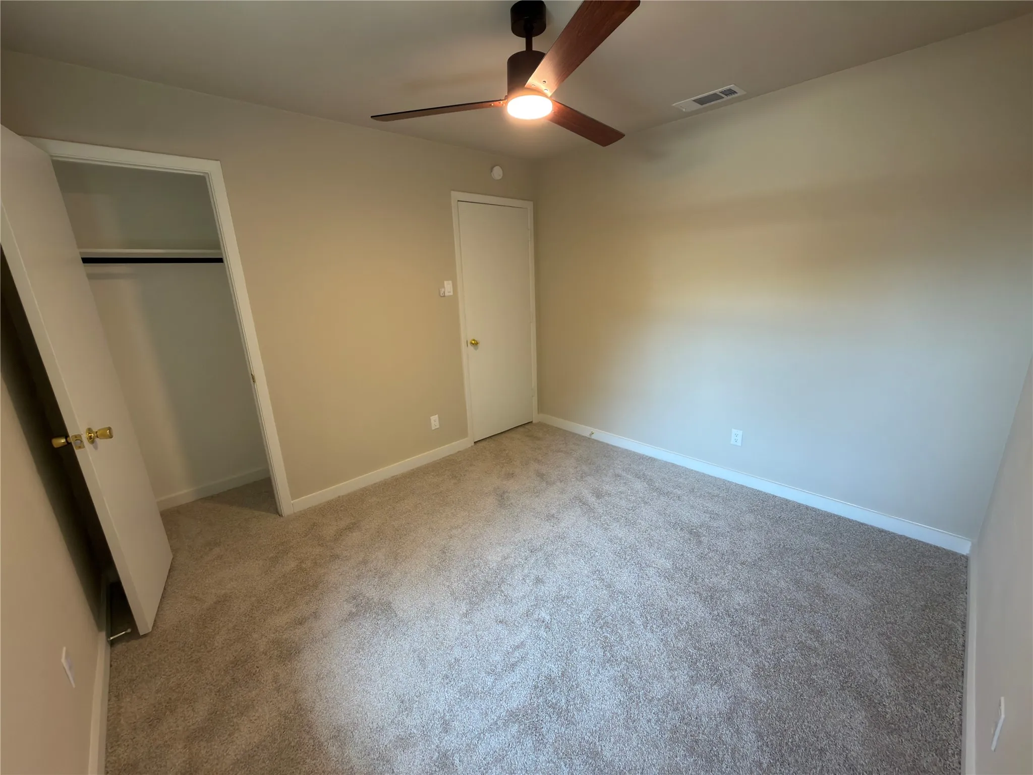 Neutral-toned carpeting throughout