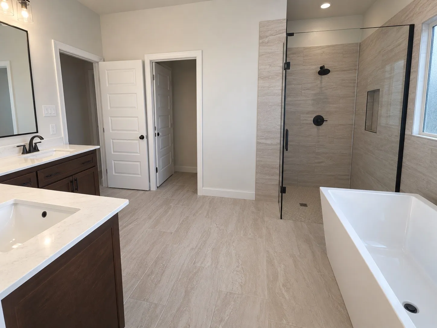 Dual vanity with undermount sinks and white countertops