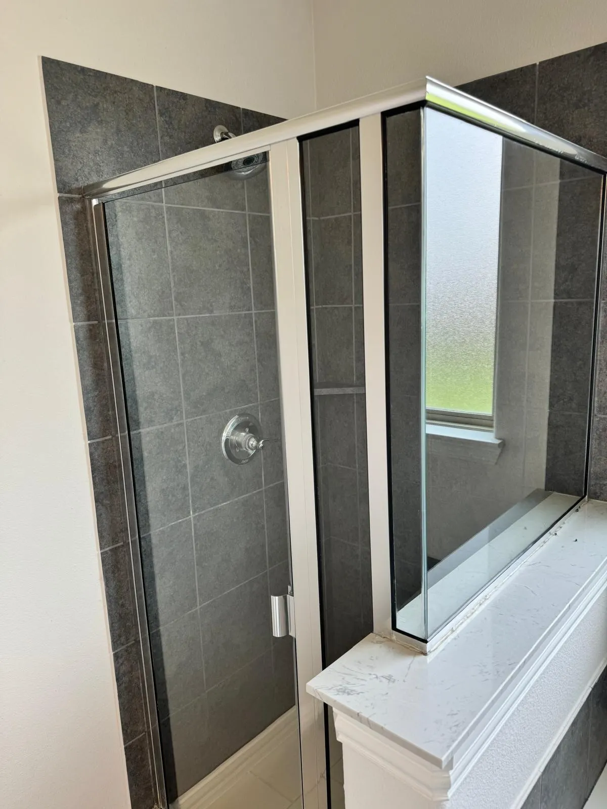 Bathroom with a shower with door