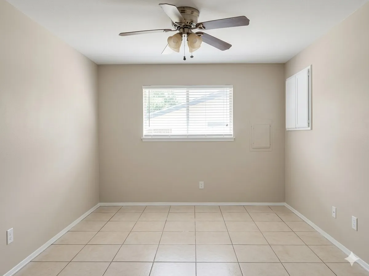 Recessed window with horizontal blinds, ceiling fan, neutral paint, and square tile flooring