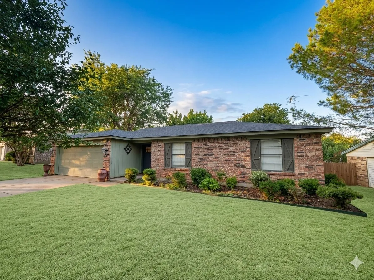 Brick exterior with contrasting green siding and a two-car garage