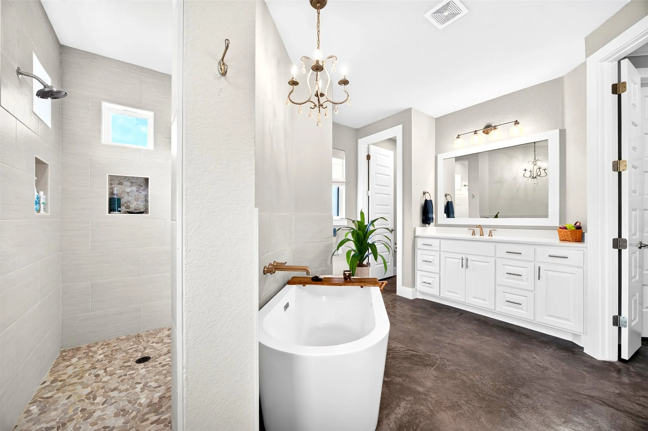 Your primary bathroom spa retreat with walk through shower, soaking tub and separate double vanities