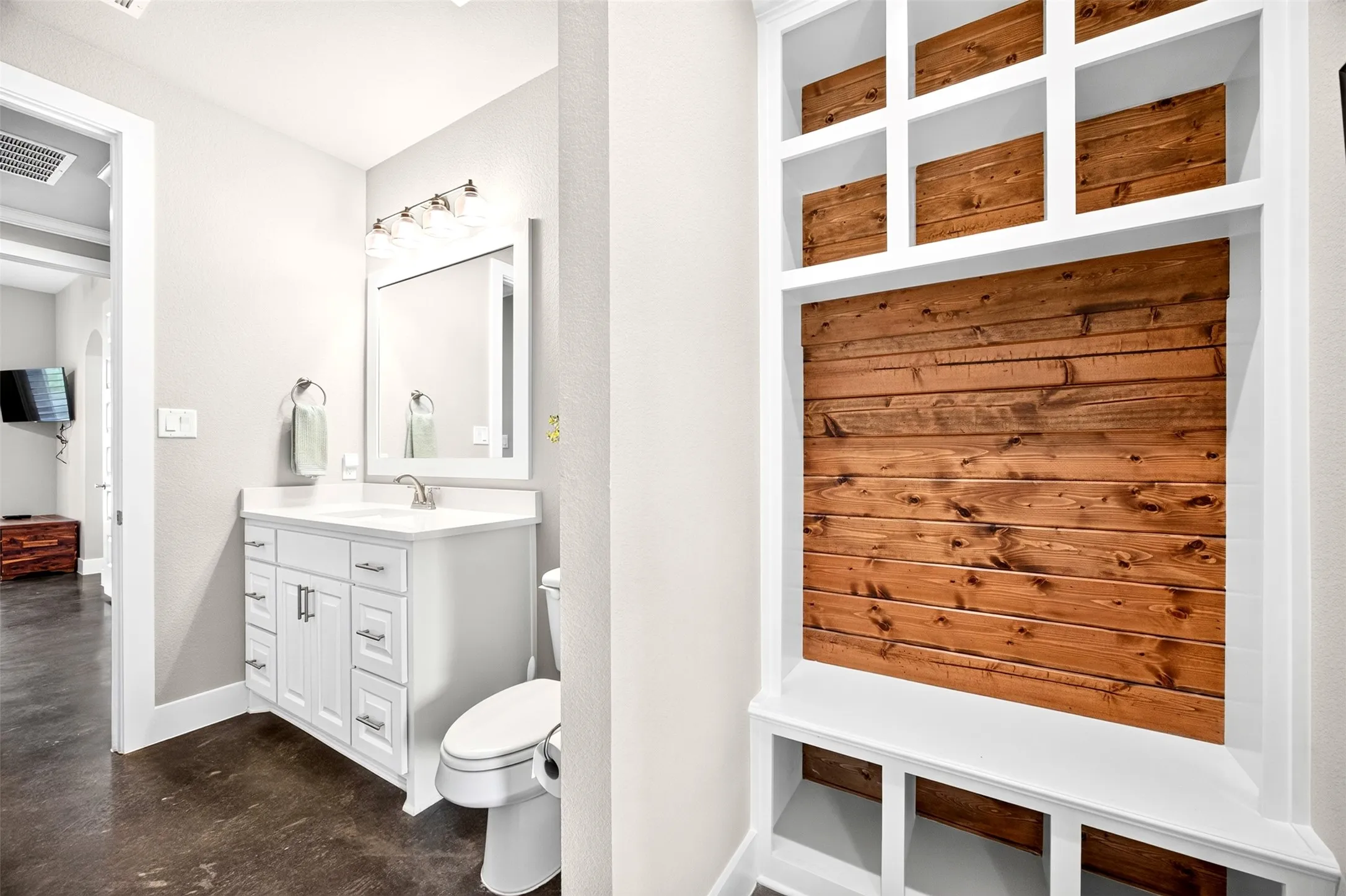 Bathroom with built in mud bench and direct patio access