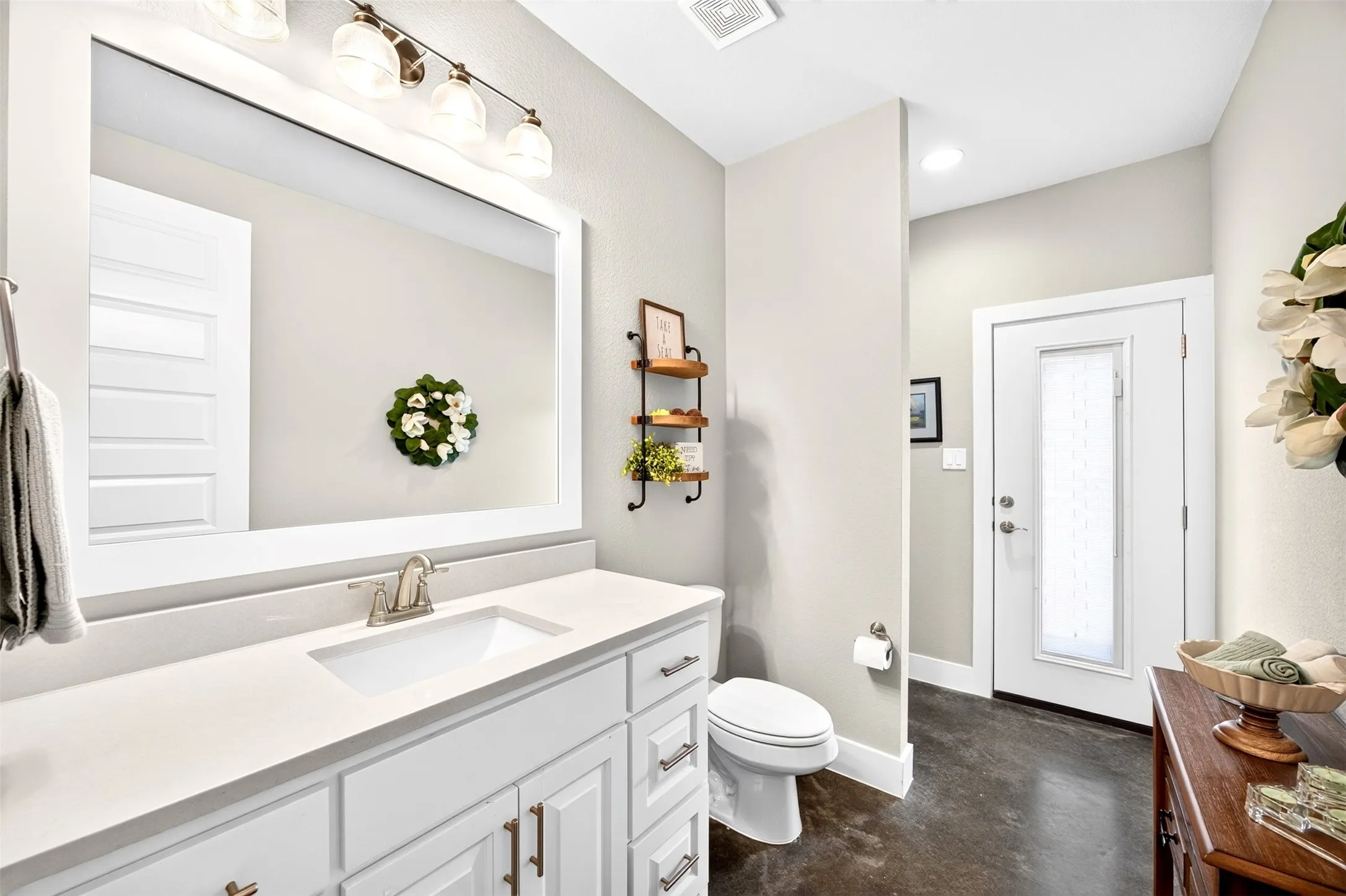 Bathroom with built in mud bench and direct patio access