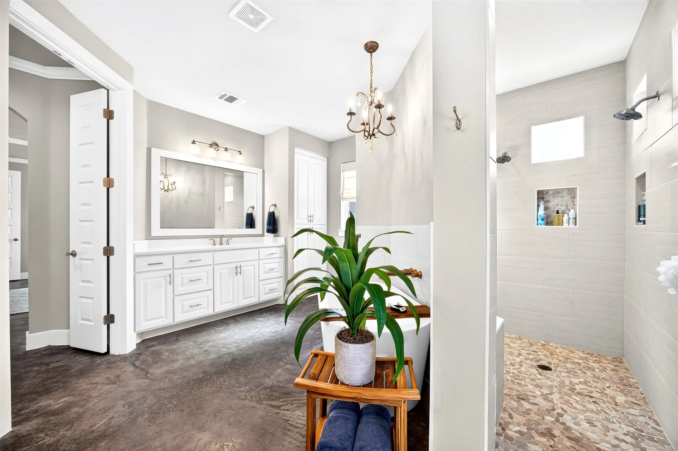 Your primary bathroom spa retreat with walk through shower, soaking tub and separate double vanities