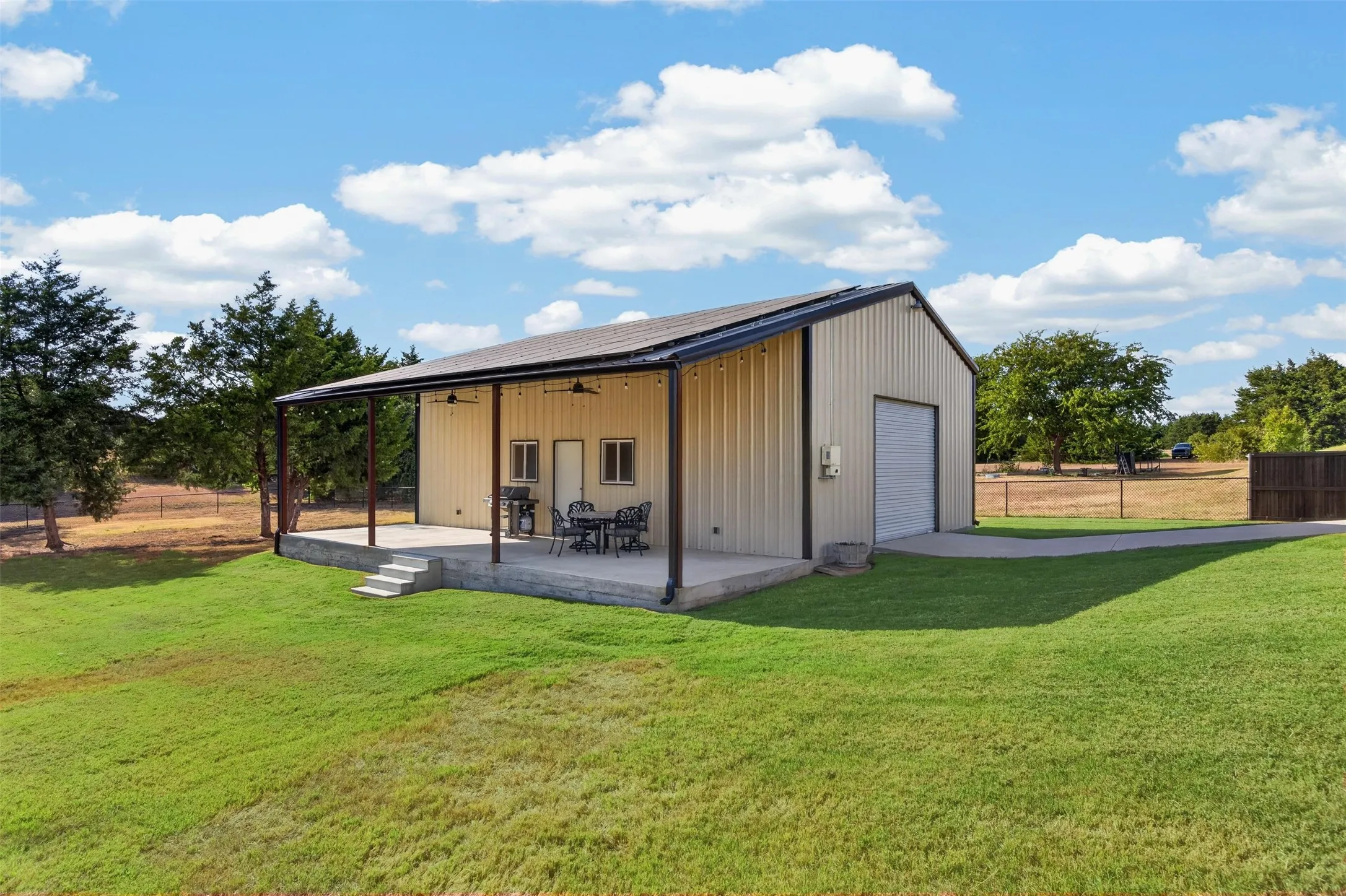 1200 sq ft sop with front and back roll up doors, electricity, 480 sq ft. covered side patio and solar panels