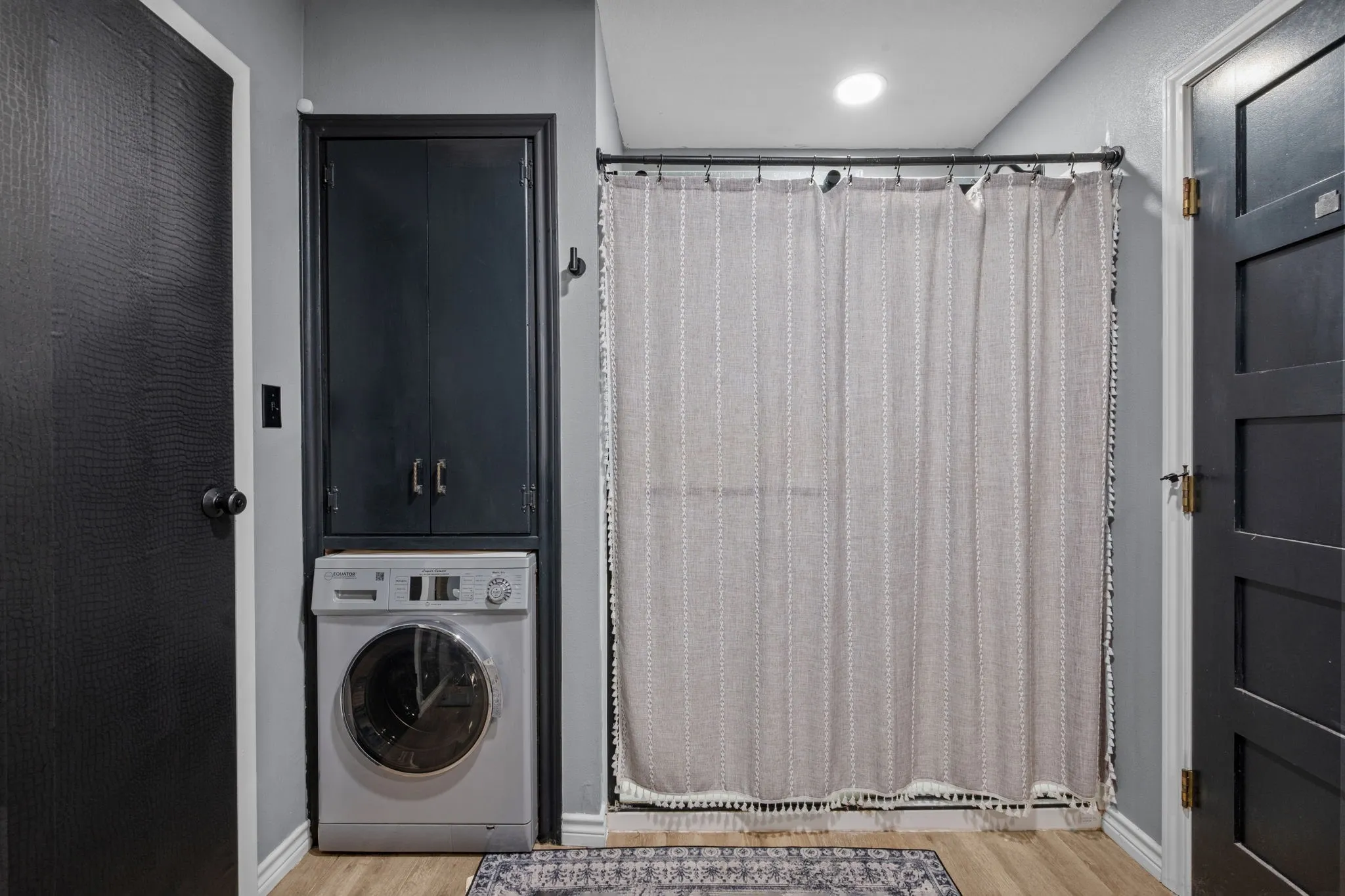 Bathroom has a washer/dryer combo