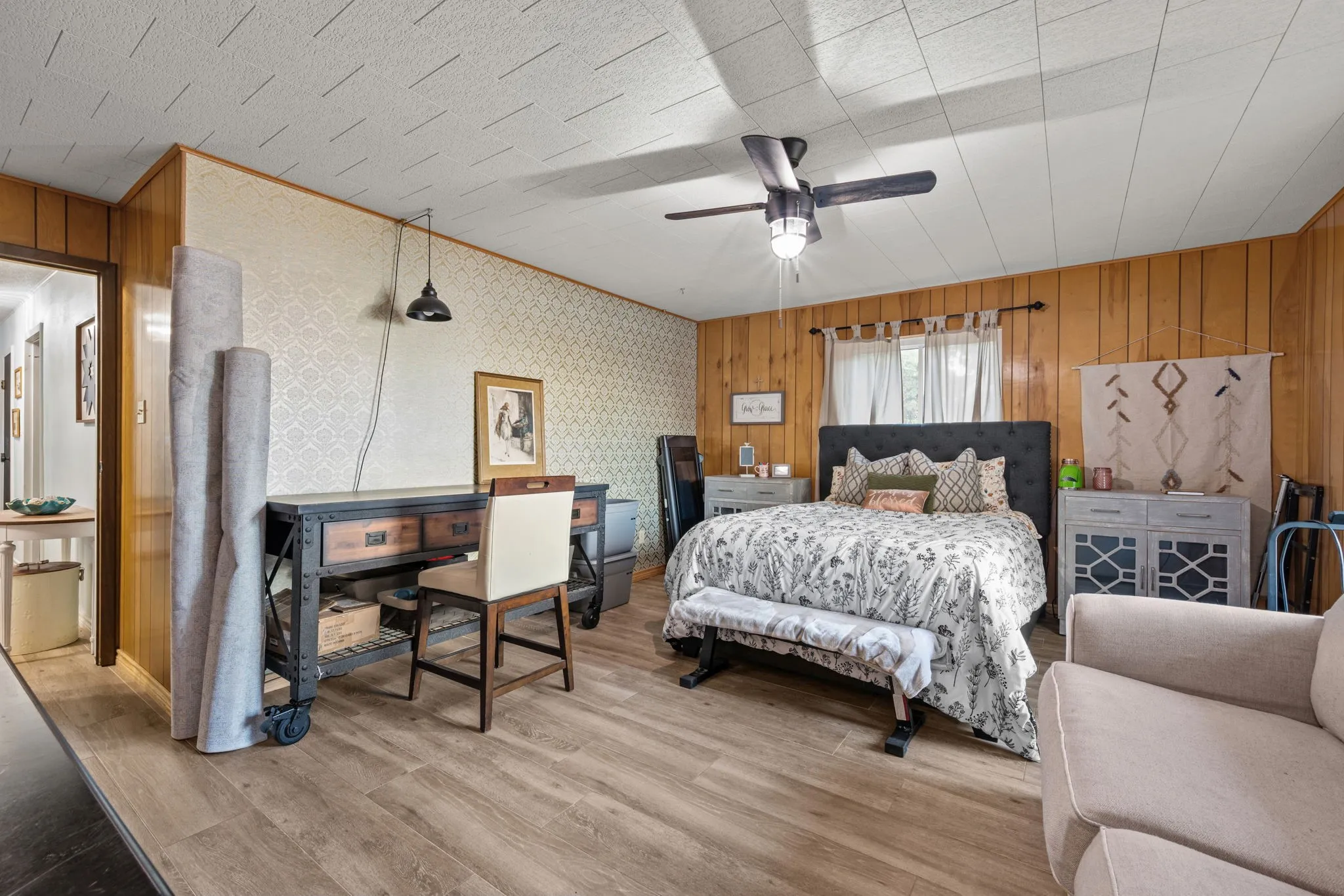 Wood-finish flooring with a decorative wall panel accent