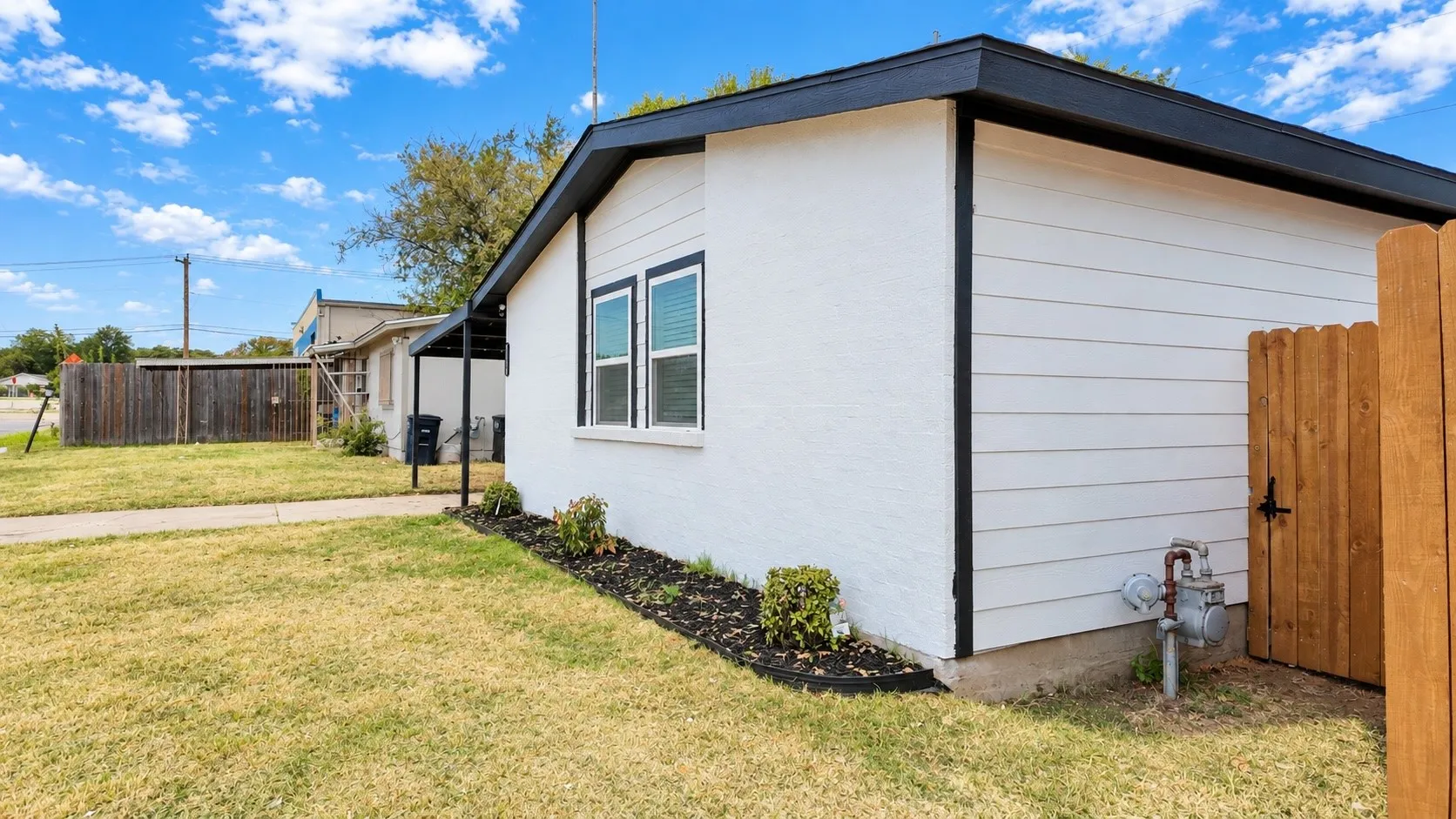 Side gate provides backyard access.