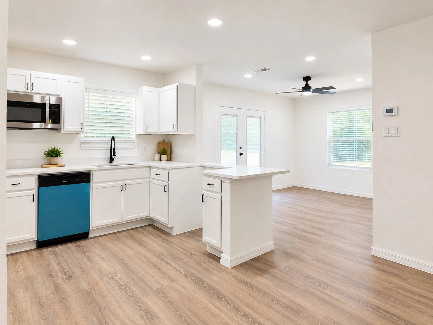 Open floor plan. Decor is virtually staged.