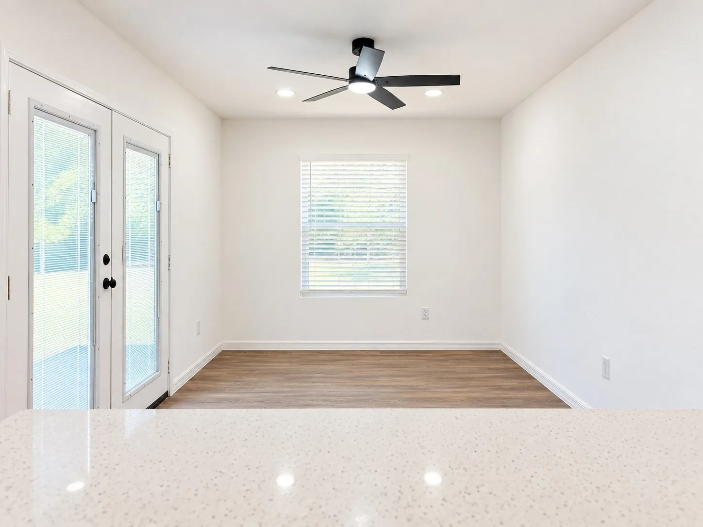 Kitchen view. Featuring French doors that lead to backyard.