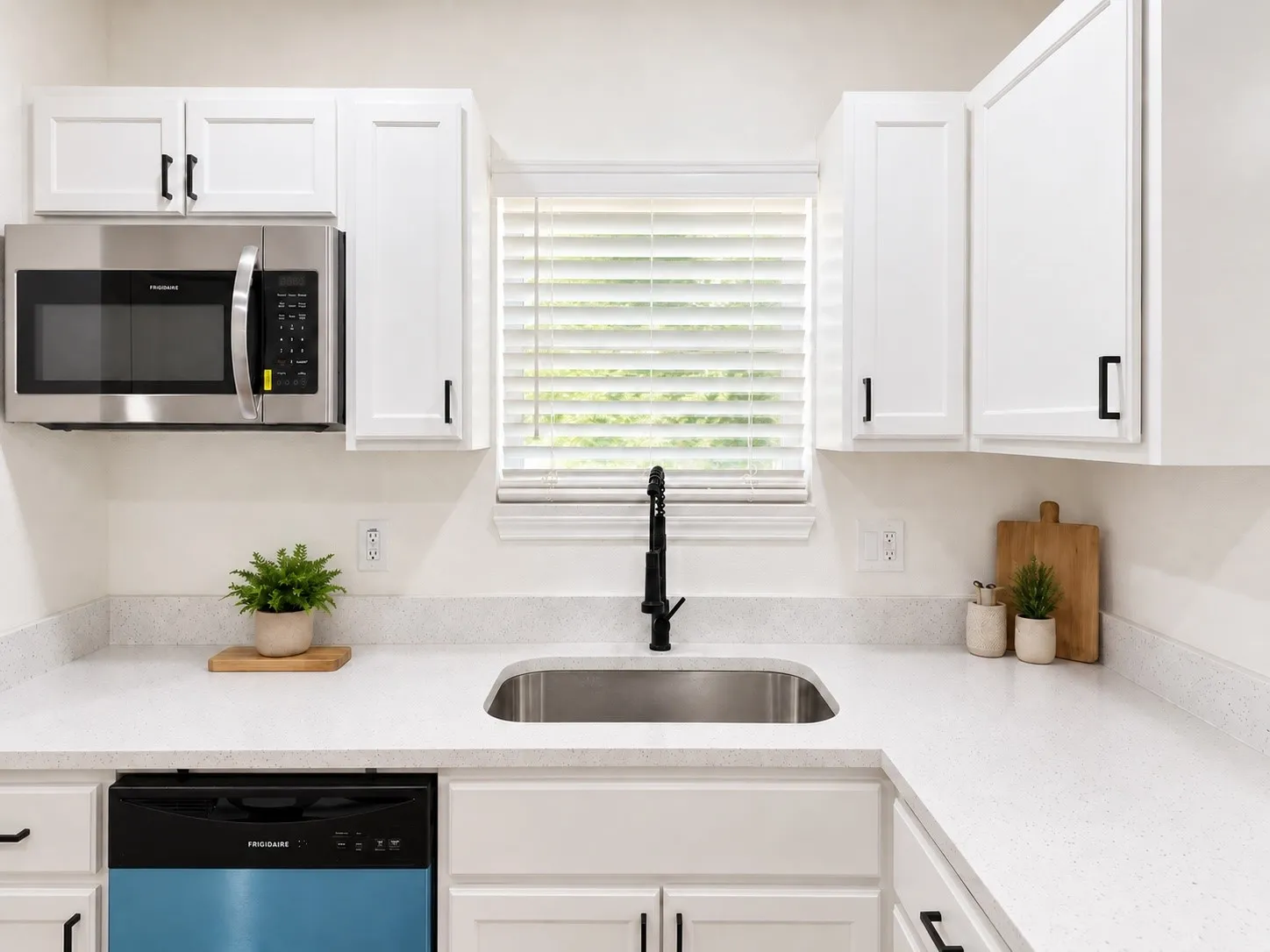 New stainless steel appliances. Decor is virtually staged.
