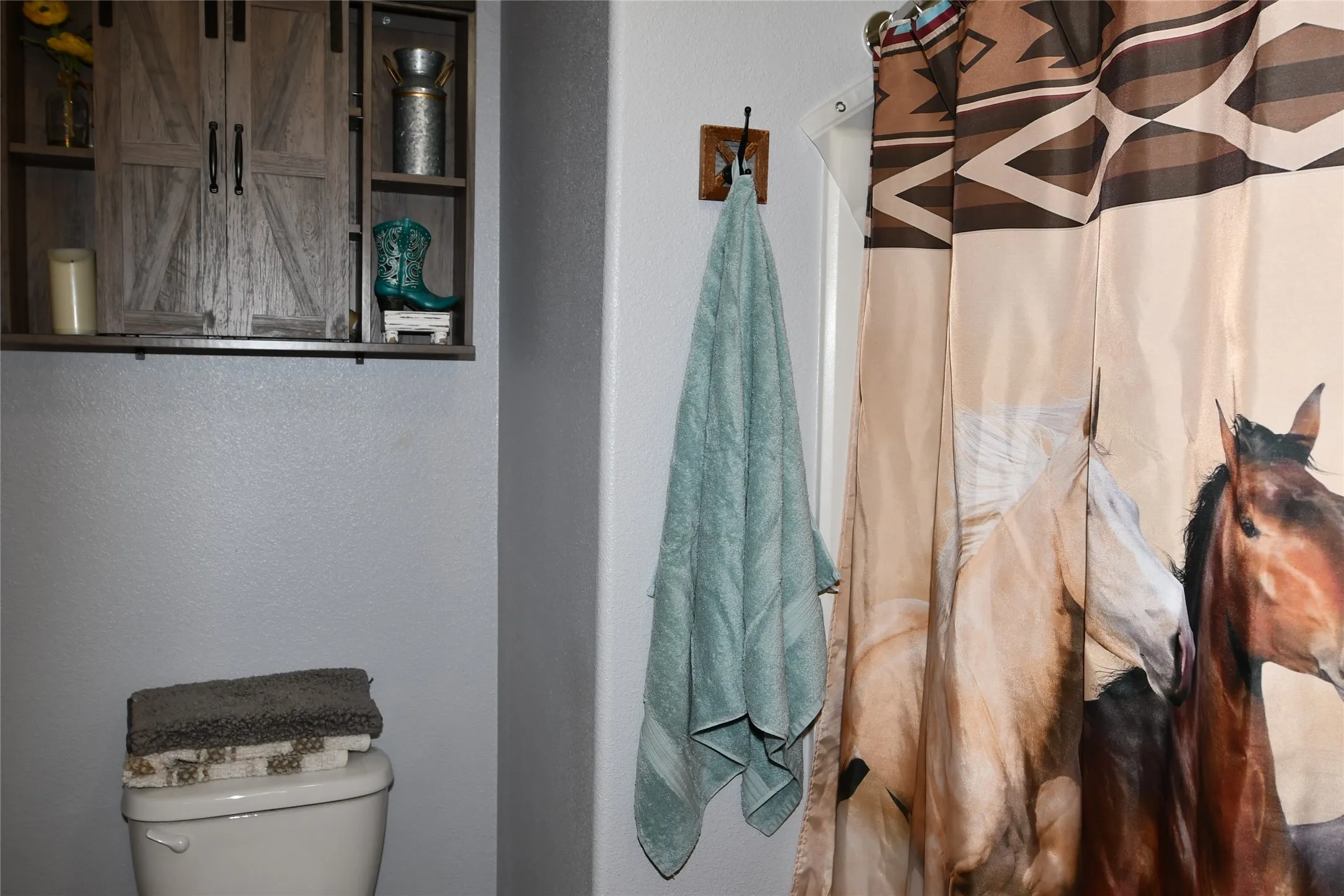 Wall-mounted shelving unit with barn door accents