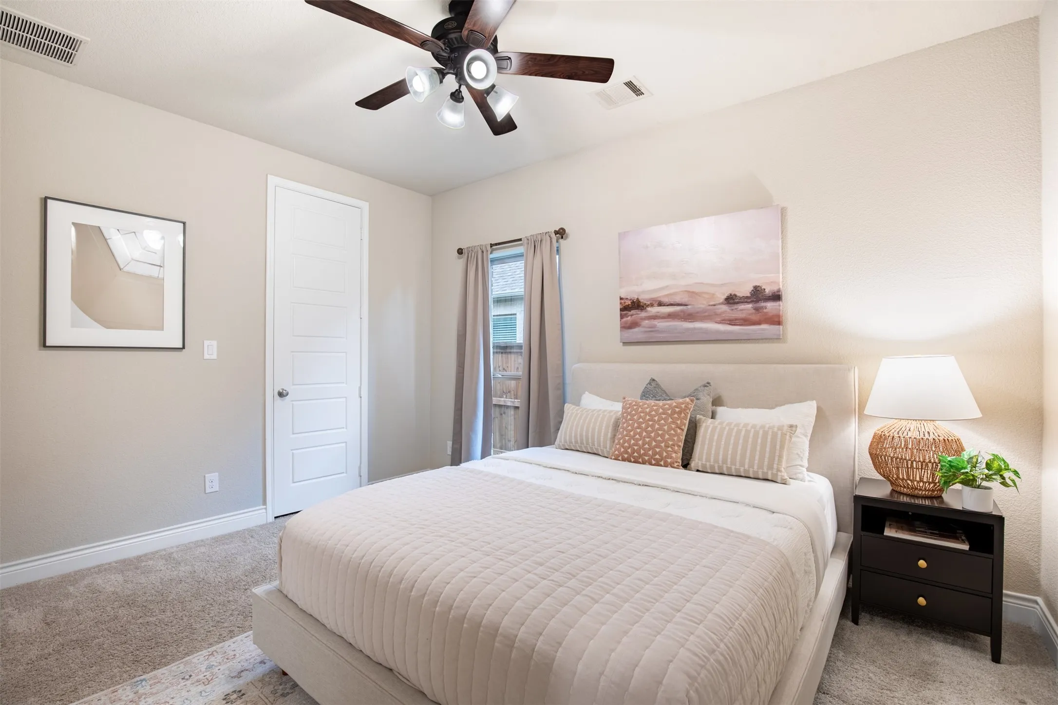 Recessed lighting, wood-finish ceiling fan with integrated lighting, paneled door, window with drapery, and carpet flooring
