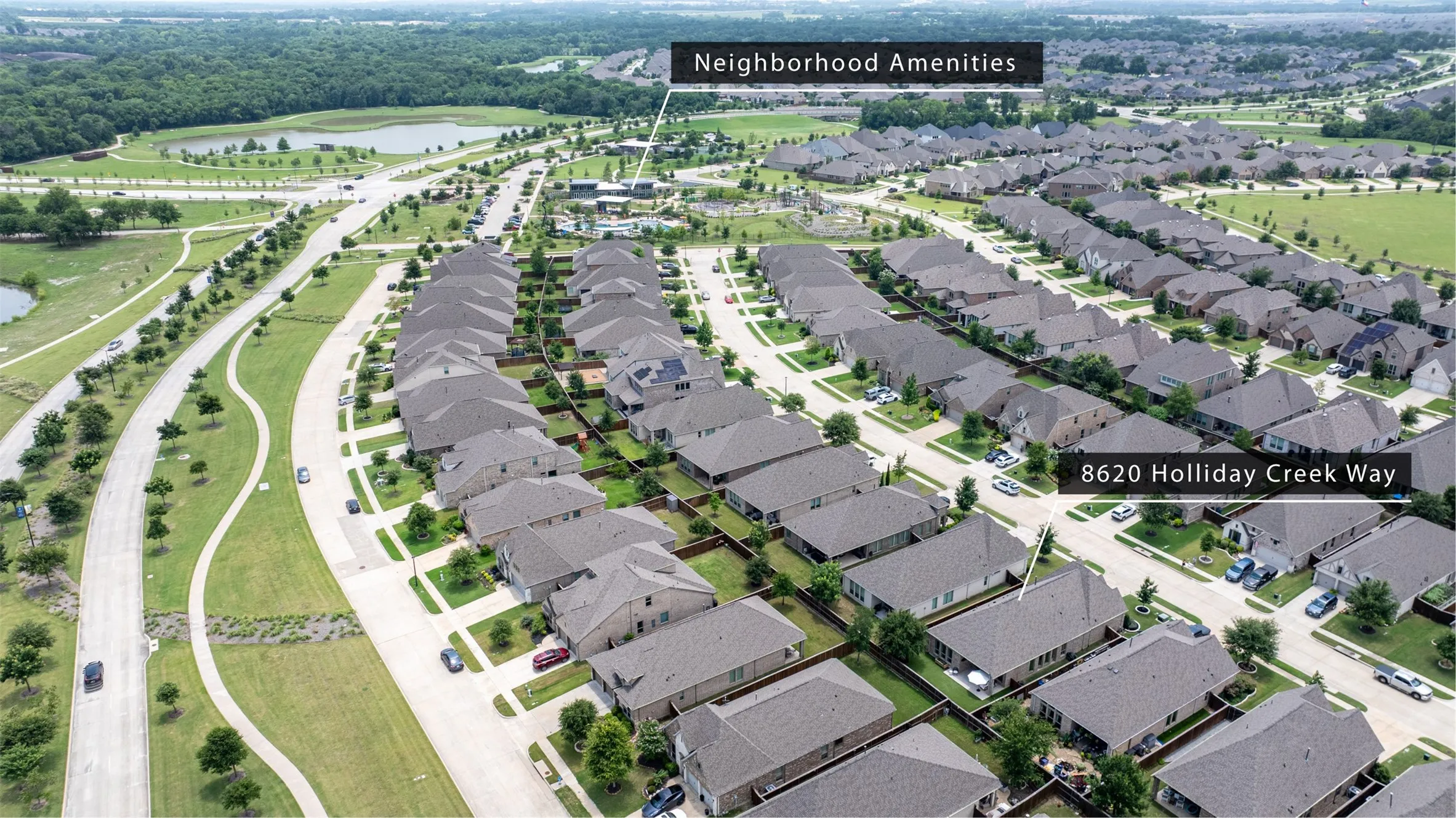 Aerial perspective showcasing a residential community with uniform roofing and a consistent architectural style