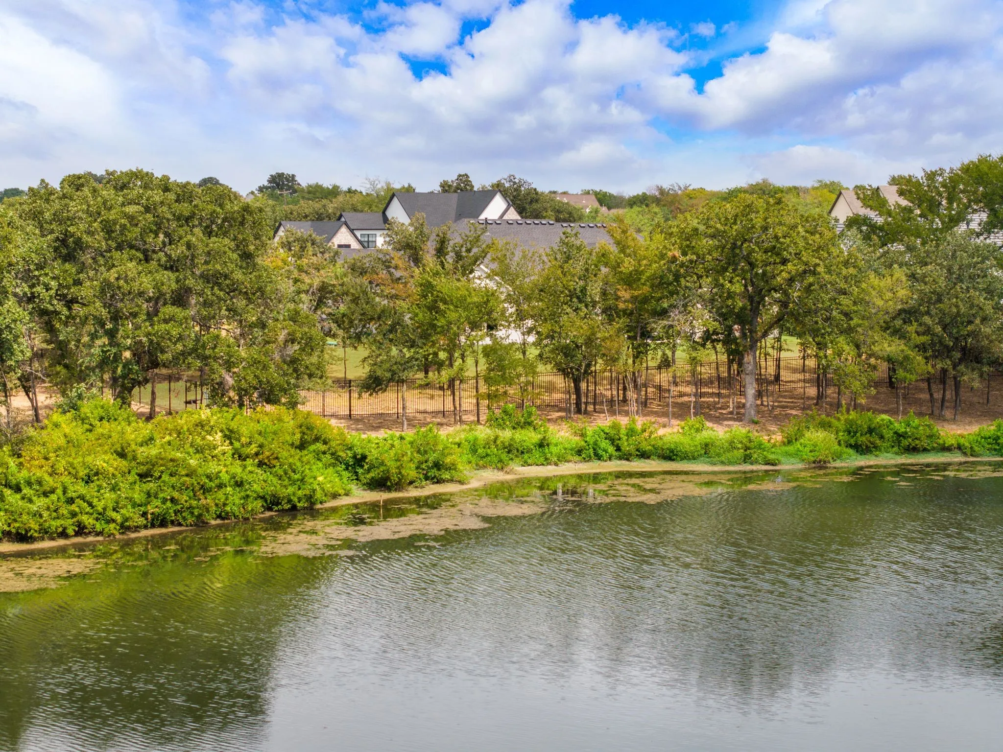 Water views from almost everyroom . This is one of the best lots in this Luxury neighborhood
