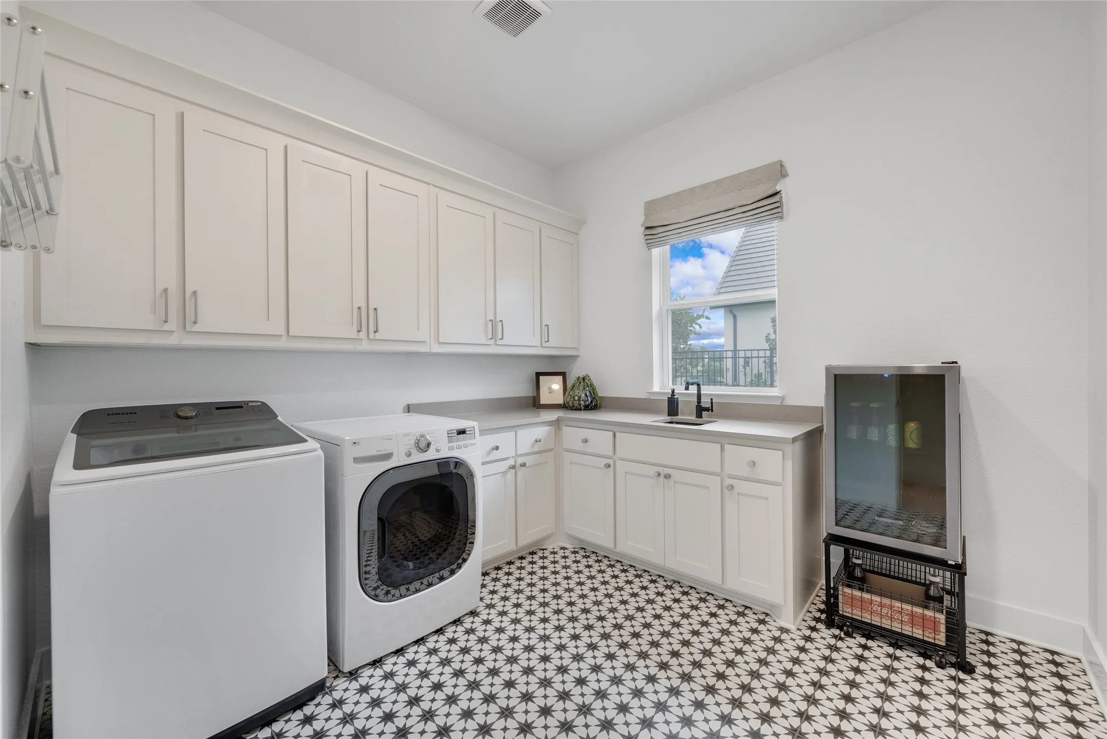 Separate laundry room 10x10  with a sink