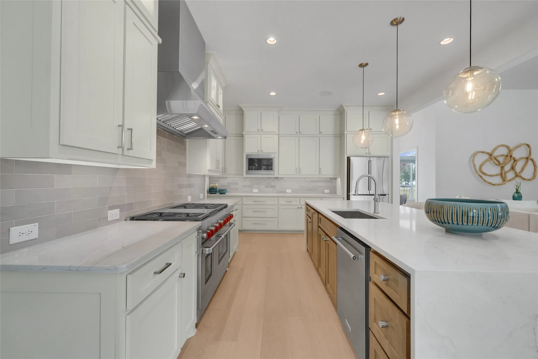 48 inch Wolf commercial grade gas range and vent hood. Two ovens: one convection & regular