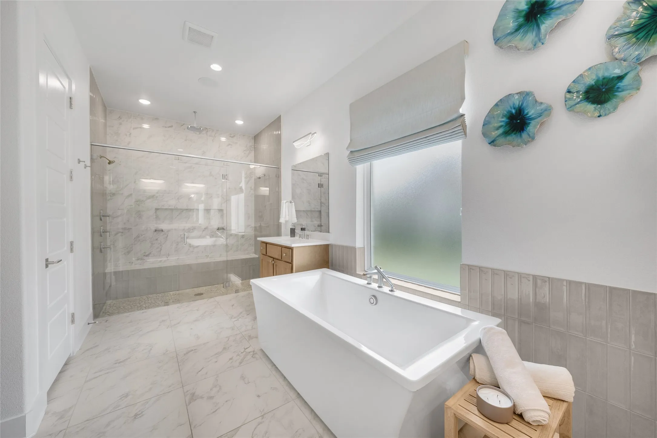 The extra large shower has double heads and a rain shower head above