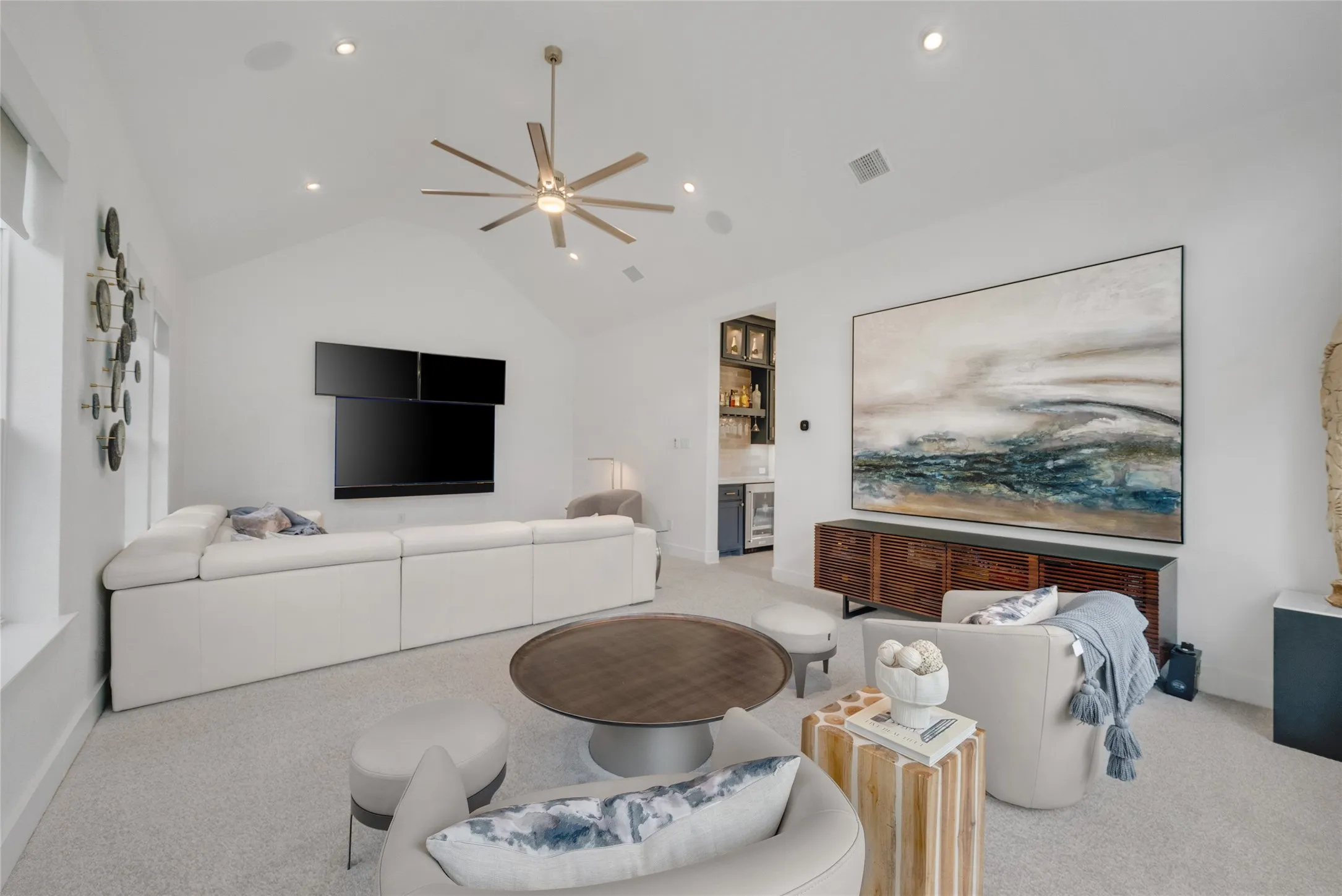 2nd Living Area conveniently located off the kitchen & dining areas and the half bath plus a built-in butlers pantry/ bar