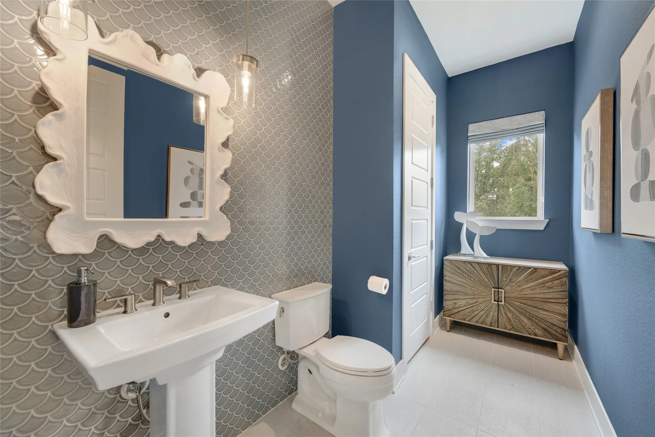 Half Bath right across from the Built-in Butlers Panry/Bar