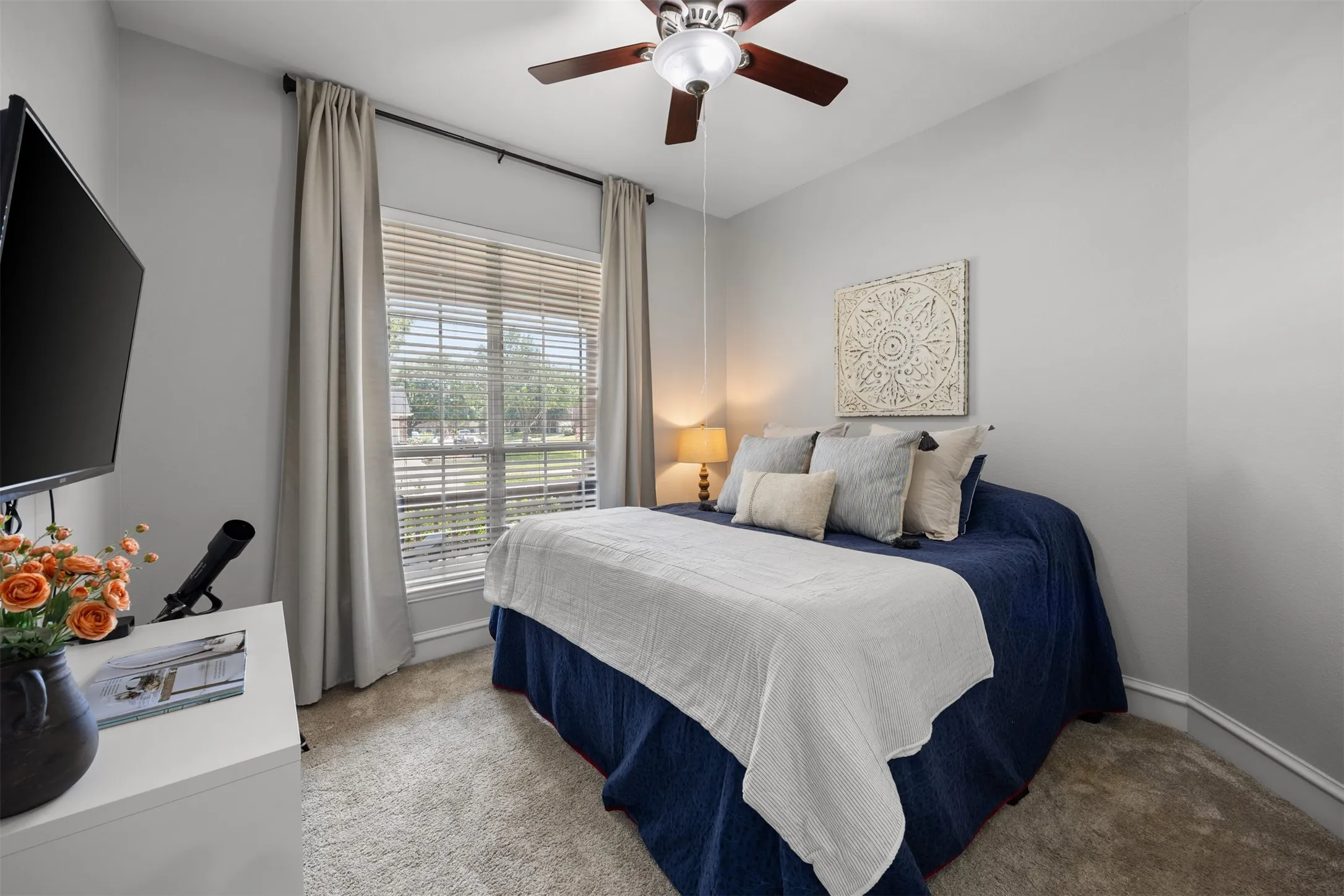 A downstairs secondary bedroom with a full bath provides a wonderful private space for guests or family. This room is huge!
