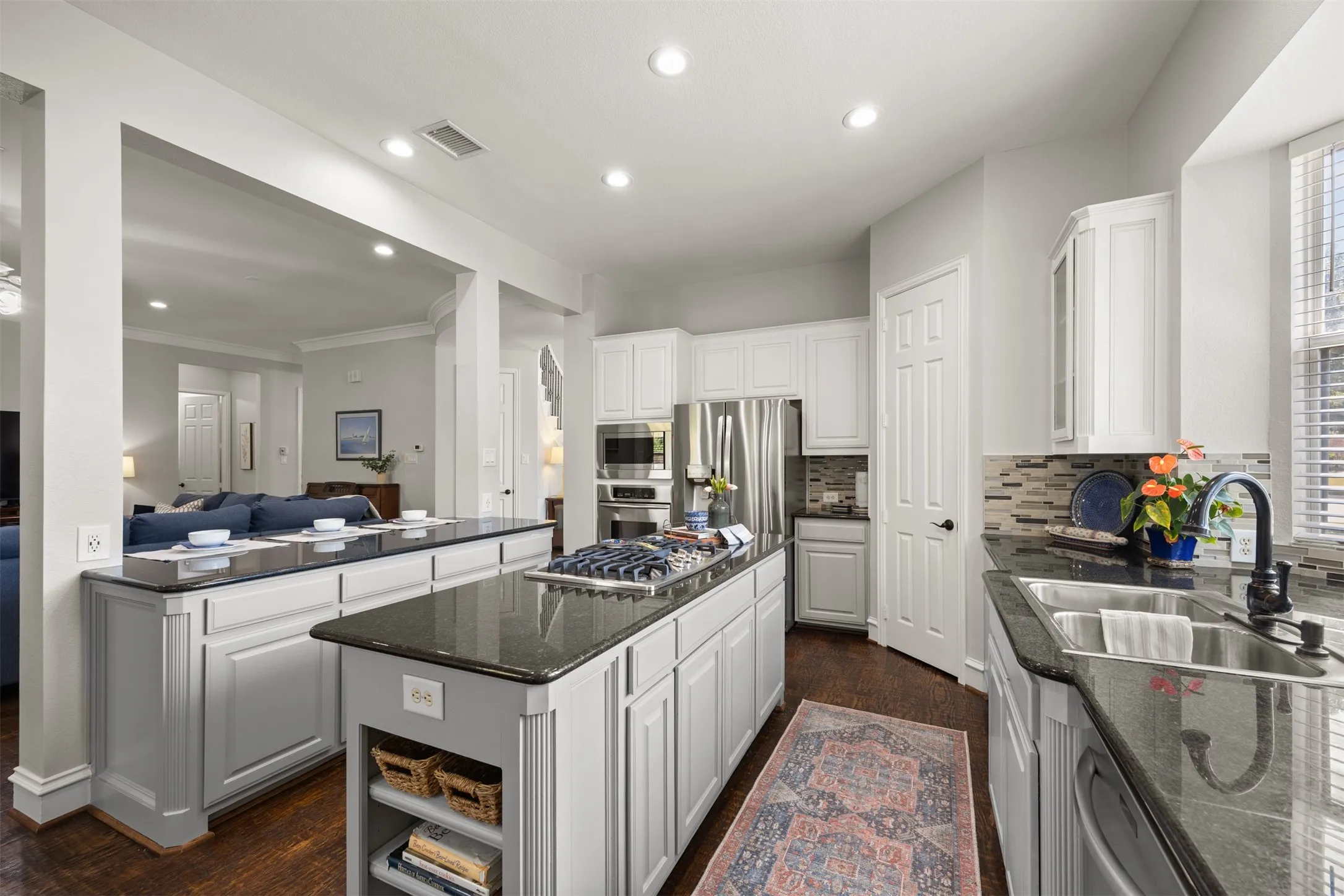 You will love the tuxedo style painted cabinetry with plenty of counter space!