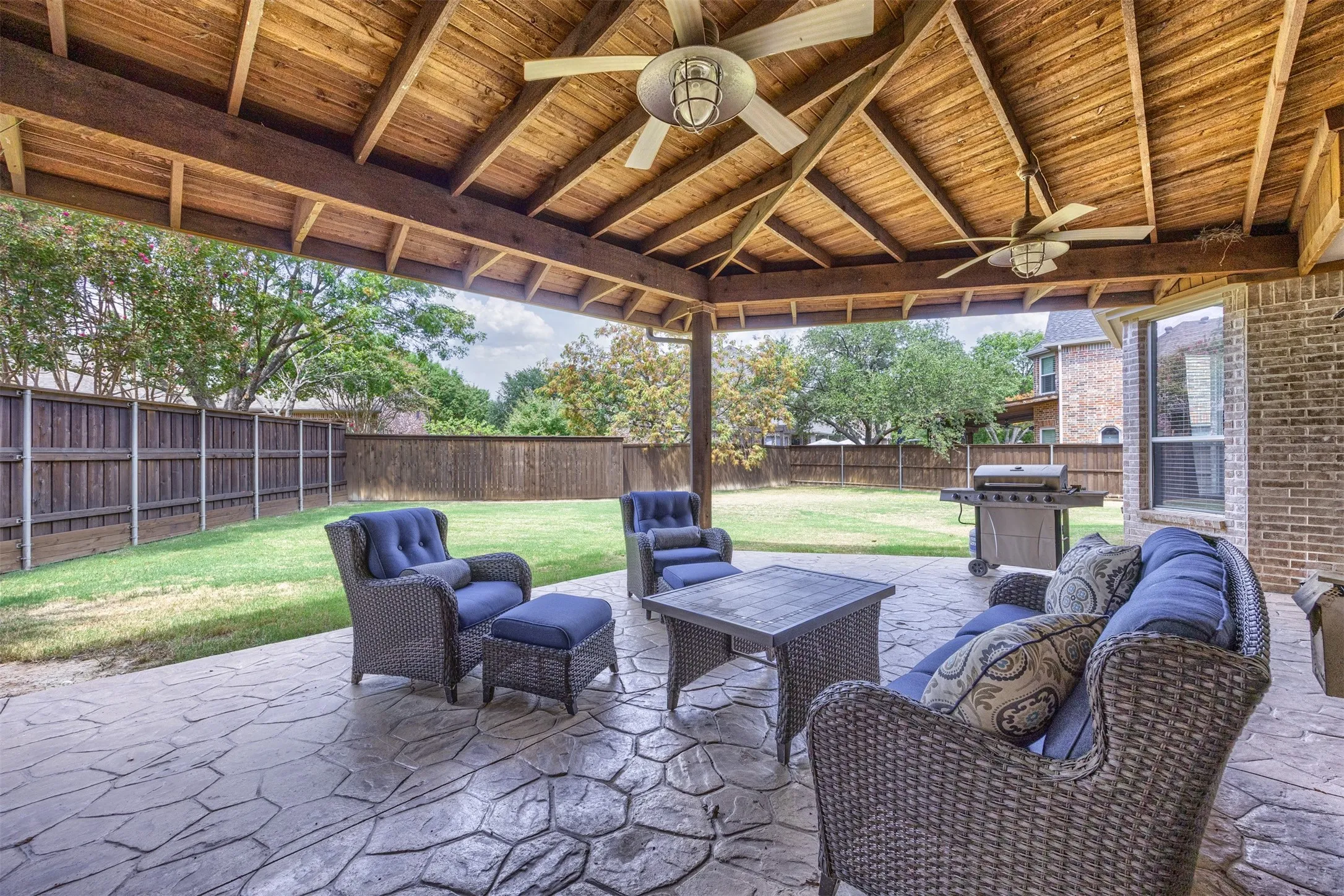 Dine alfresco or host a barbecue under the custom covered patio with an extended cover!