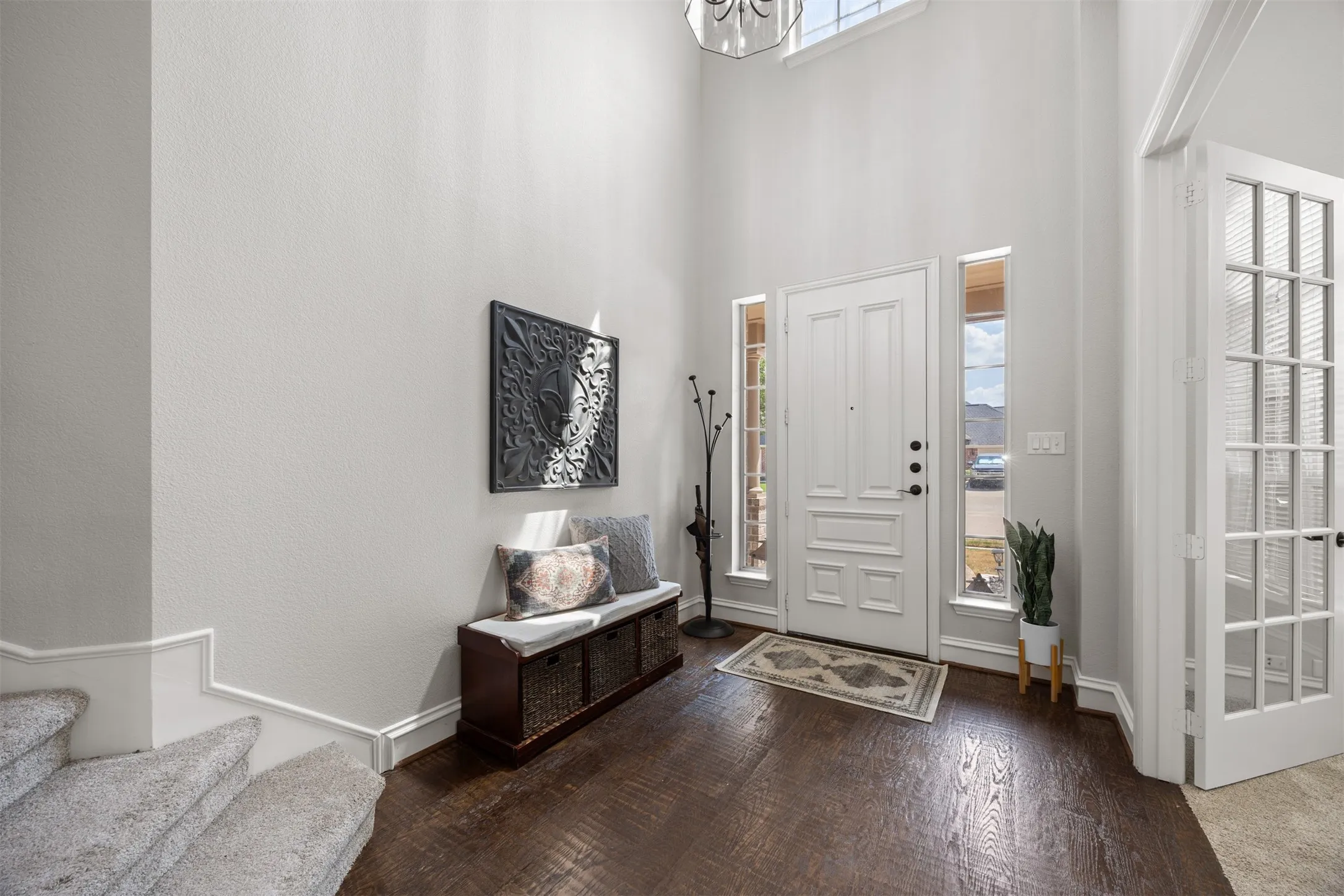 This spectacular two story entrance is breathtaking! Dreamy nail down, lightly hand scraped, wood floors. Come on in!
