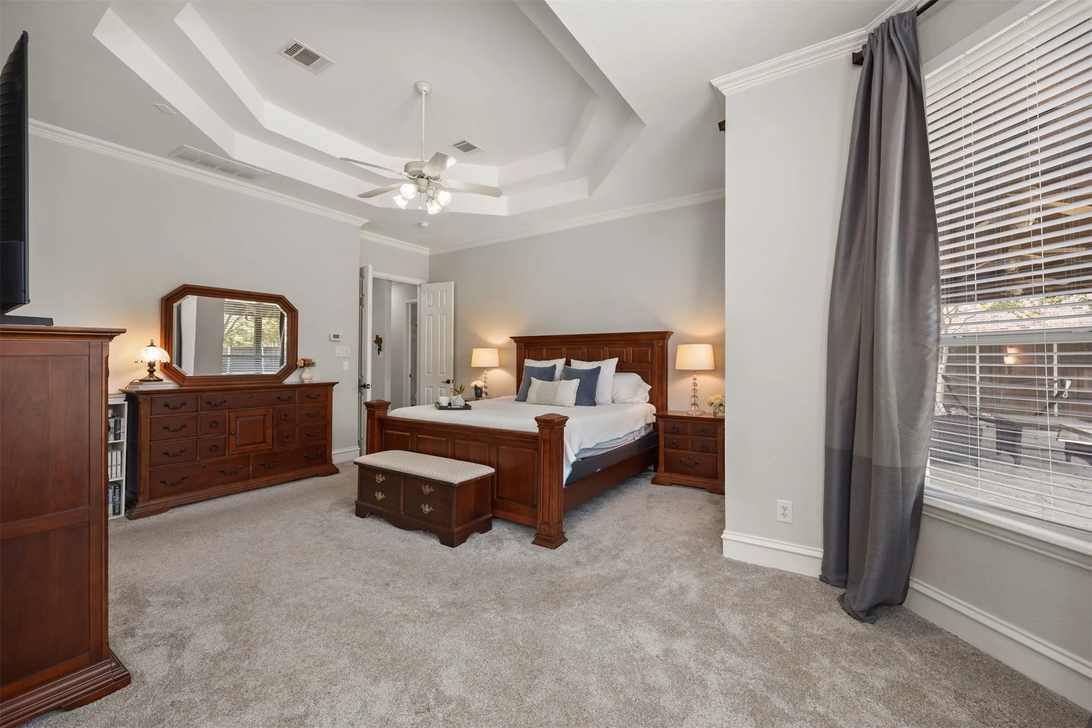 The tray ceiling in this spacious haven is perfect for unwinding at the end of a long day! You even have room for a sitting area!