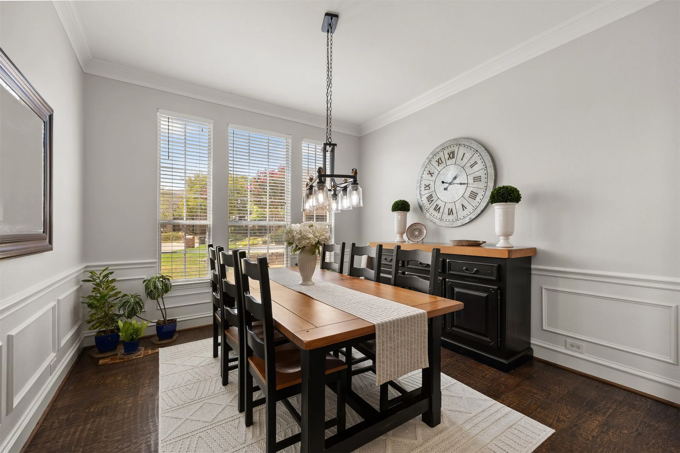 This impressive formal dining room is ready for holidays, celebrations & dinners with family & friends. You will love the architectural moldings that add design & interest!