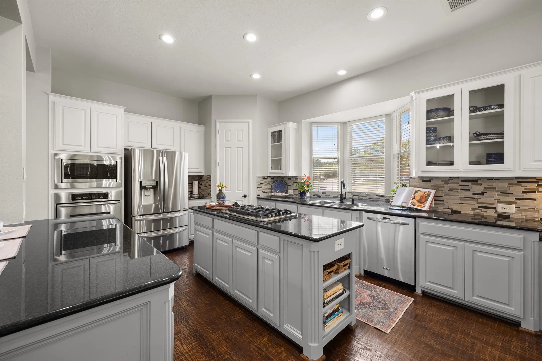 Gather around the island while enjoying double ovens, stainless steel appliances & plenty of space for cooking & entertaining.
