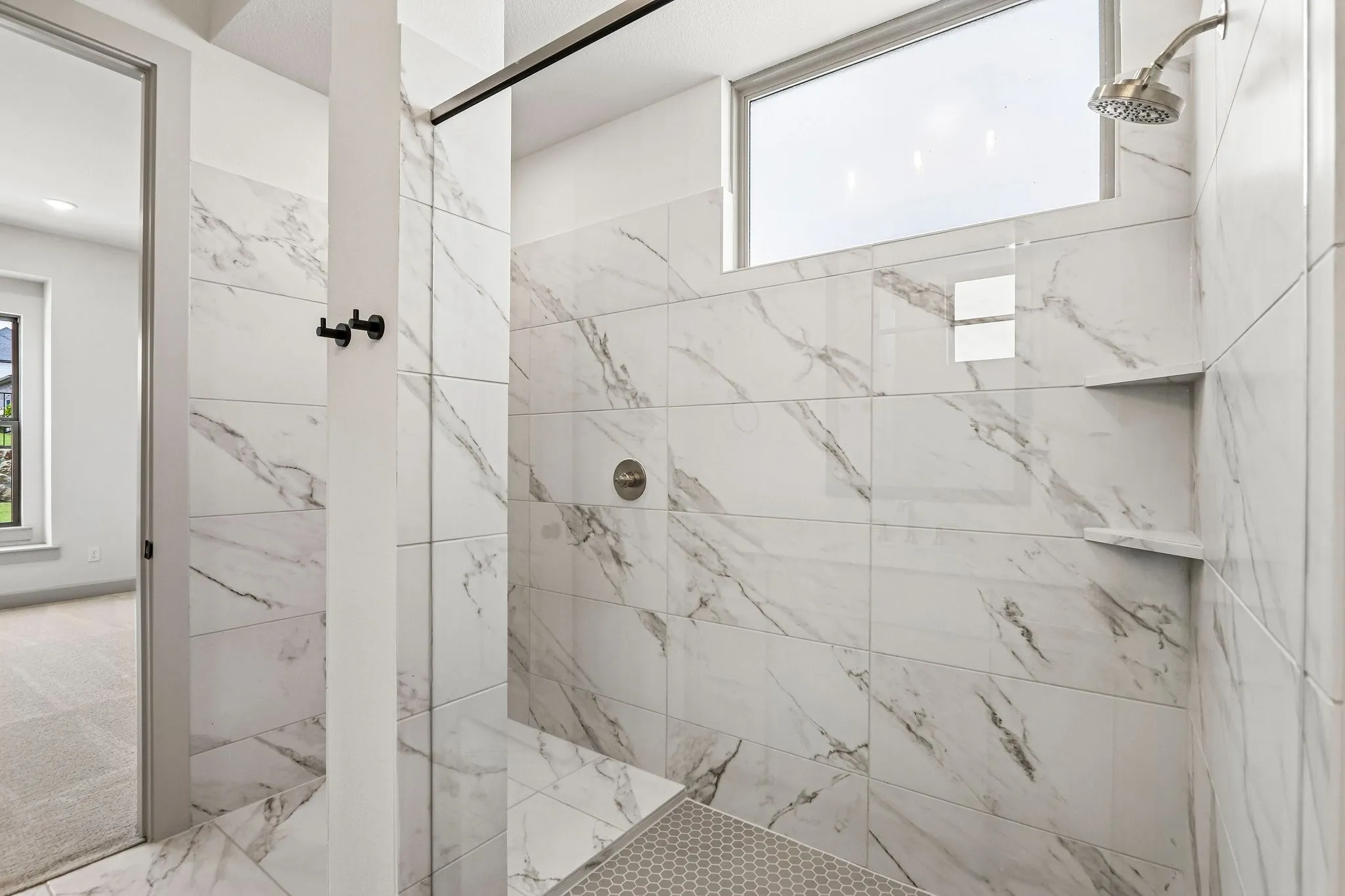 You will never want to leave this spacious walk in shower in your new owner's bath!