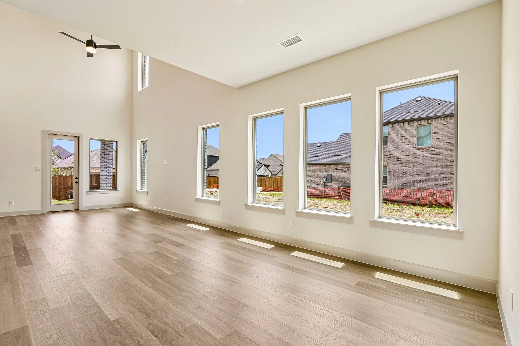 This light filled dining room featuring a wall of windows is the perfect place to host lively dinner parties or cozy family meals.