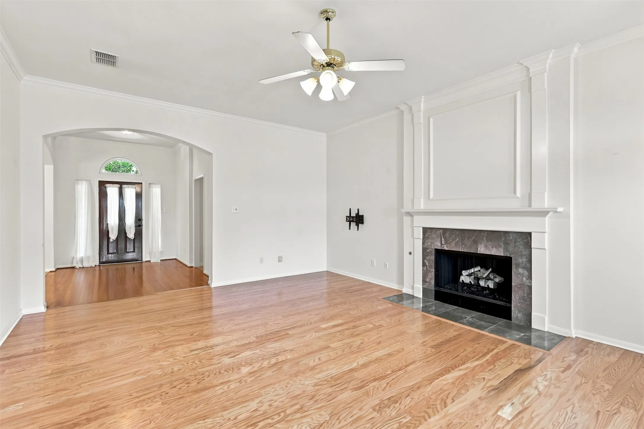 Living Room features engineered hardwood floors and gas fireplace.