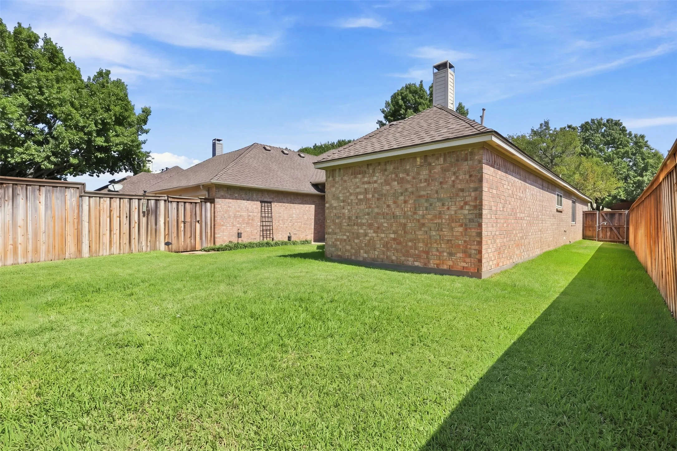Side yard leads to gate for access to the front of the home.