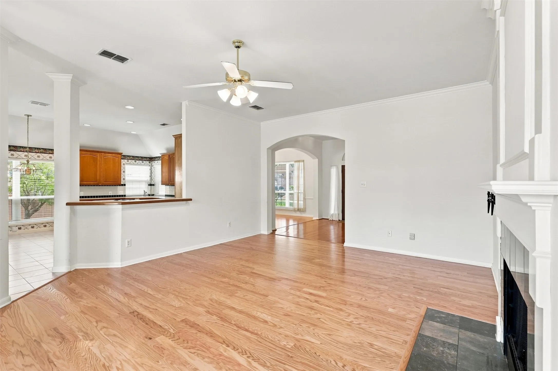 Kitchen flows to living area and dining room making the space feel large and airy.