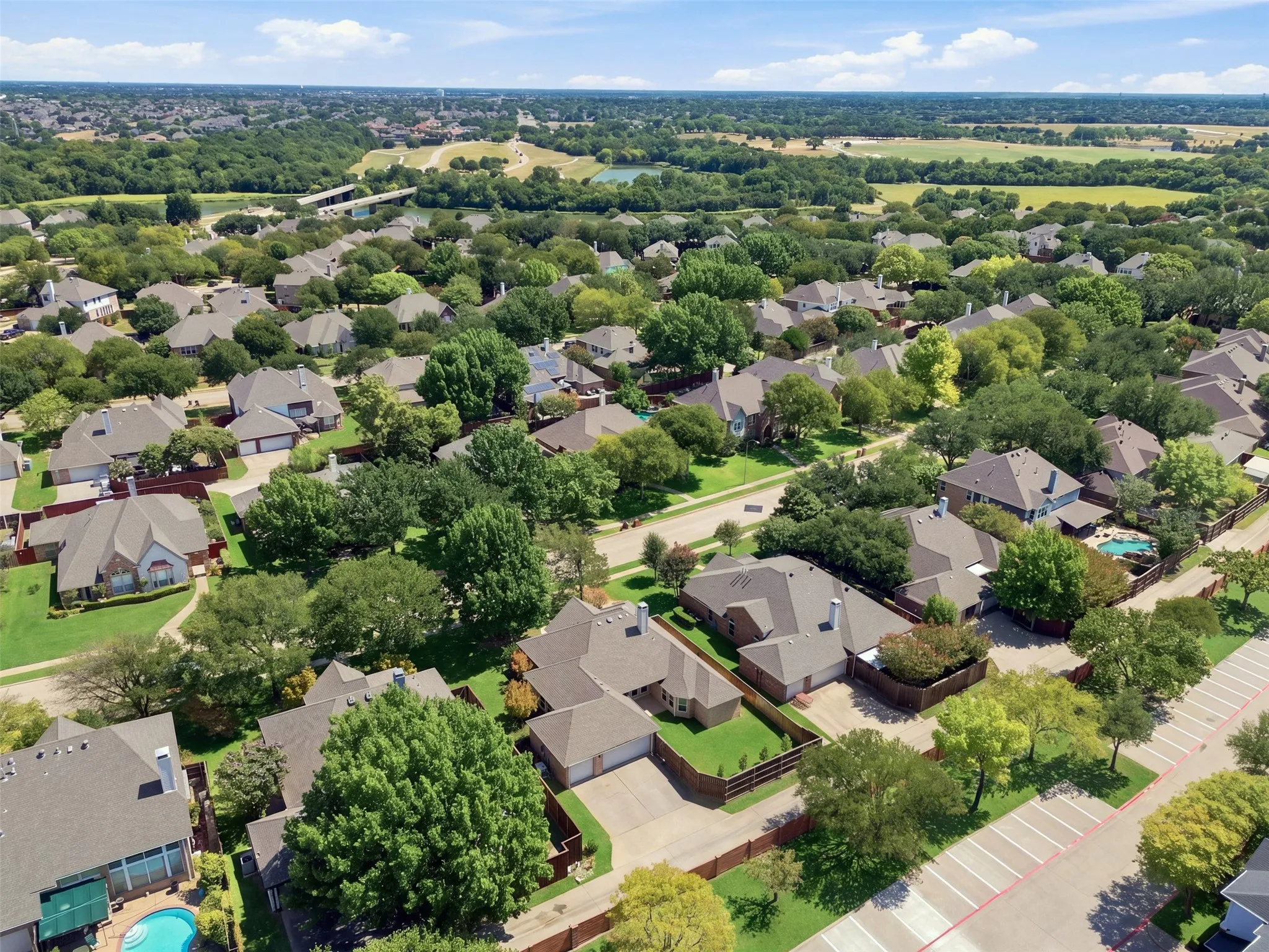 Residential Neighborhood with mature trees and landscaping.