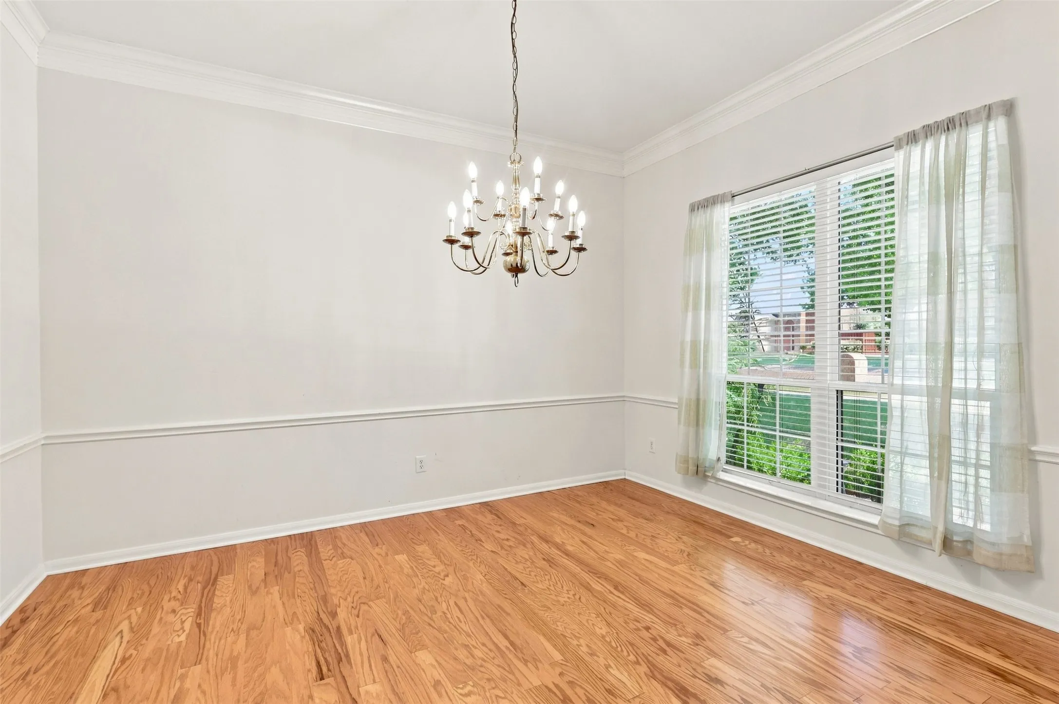 Large dining room is perfect for family gatherings with large window for lots of natural light.